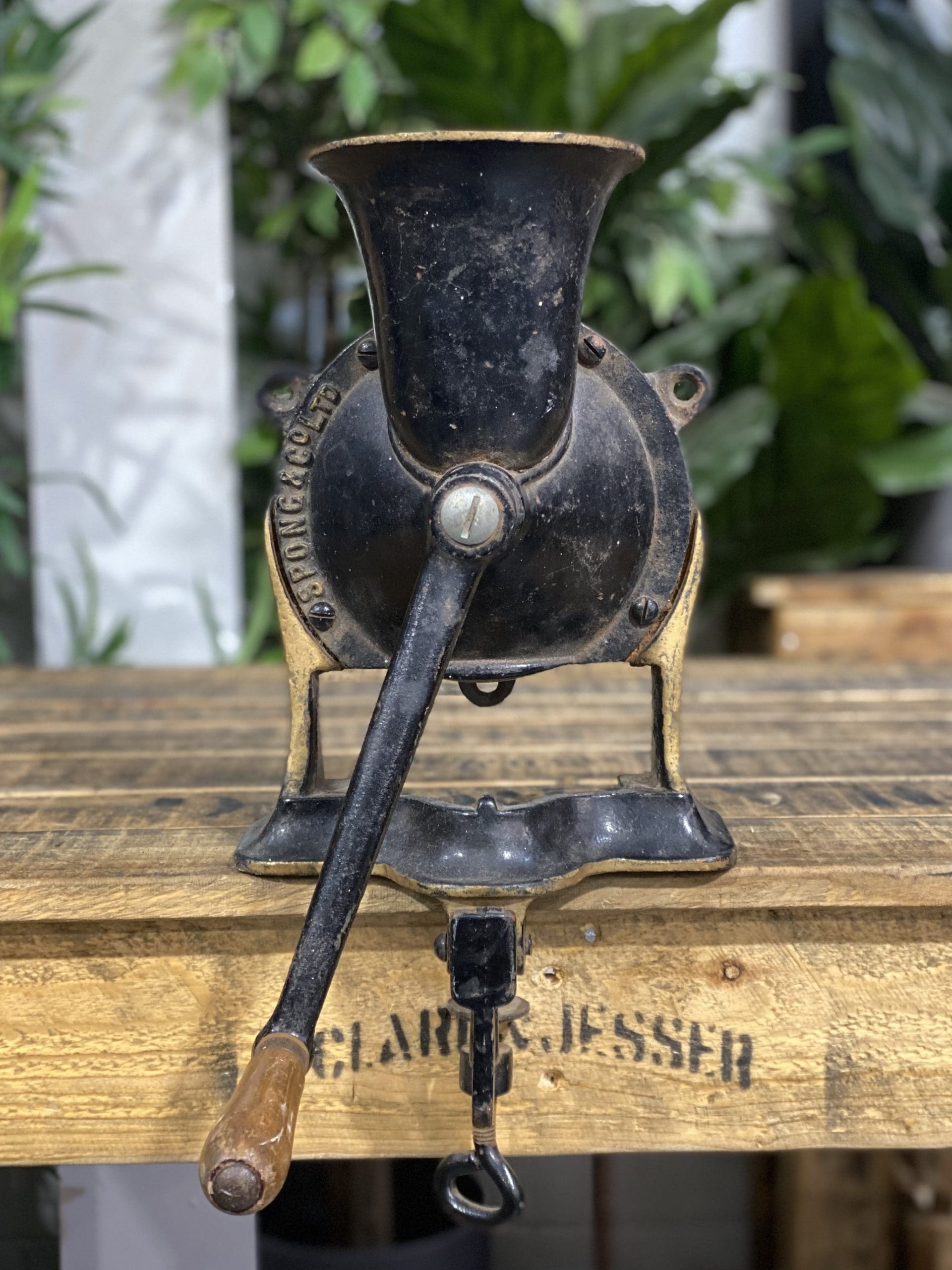 1856 No. 4 Large Spong & Co Ltd Bench Mounted Hand Grinder on display.