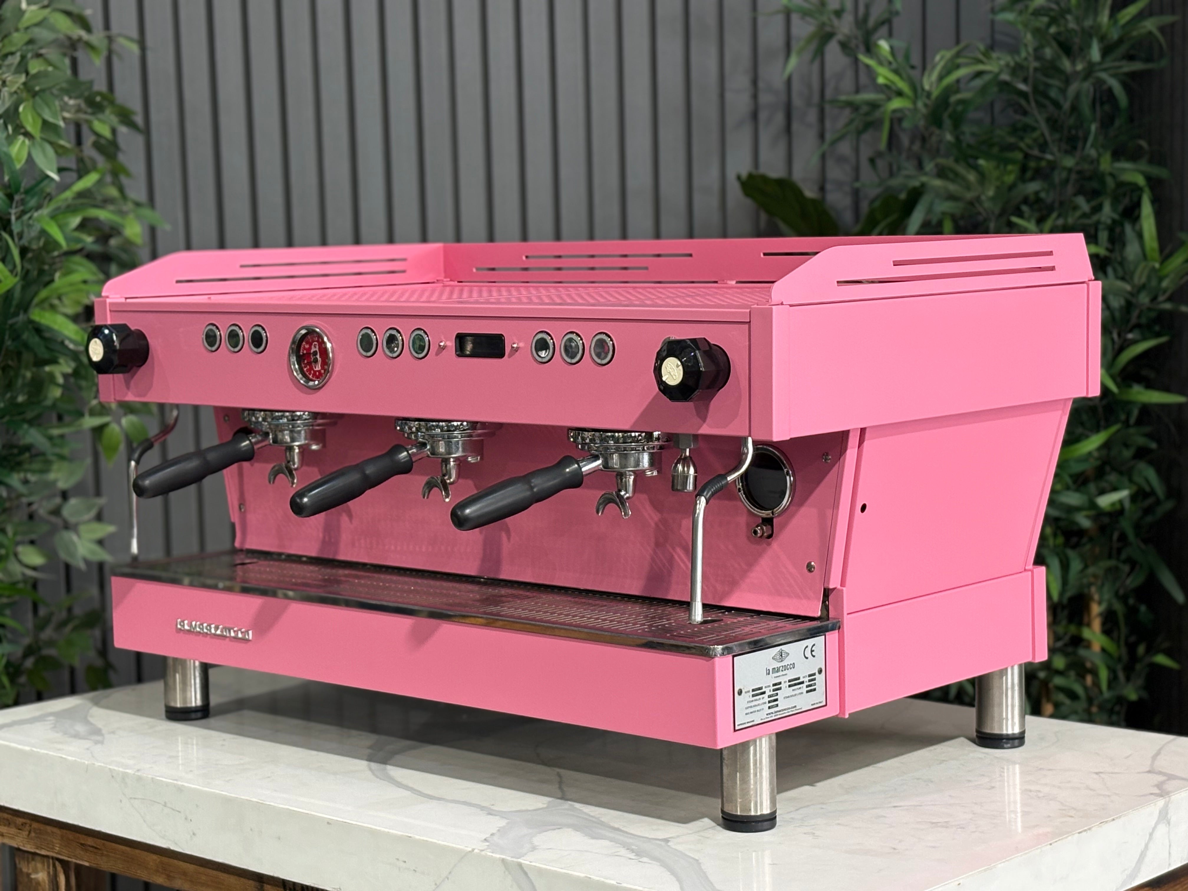 La Marzocco Linea PB 3 Group Coffee Machine Dark Pink - Used displayed on a countertop with plants in the background.