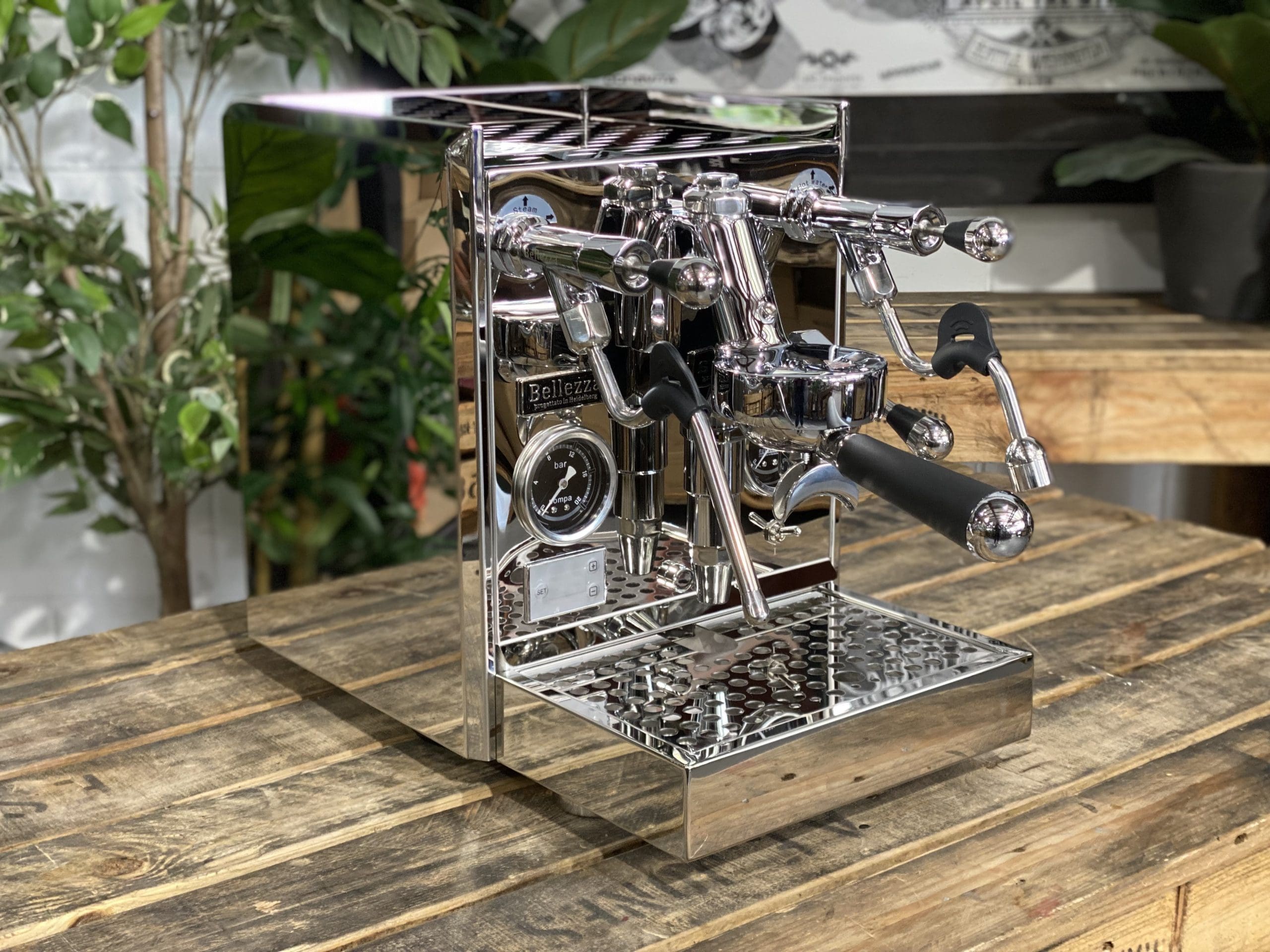 Bellezza Gulia Lever 1 Group Stainless Espresso Machine - New on a wooden table with greenery in the background