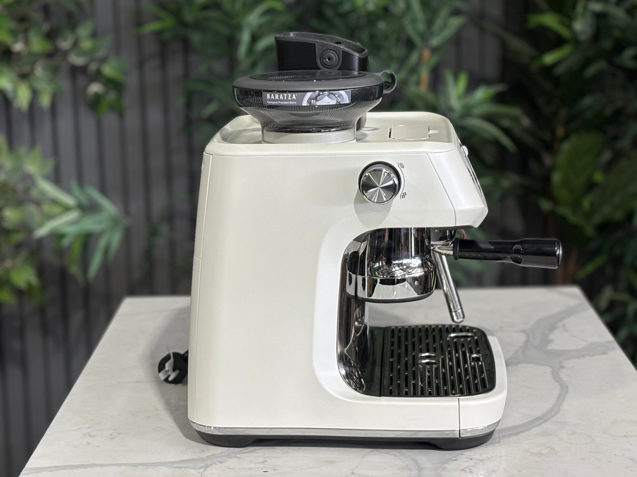 Breville Oracle Jet 1 Group Coffee Machine White - New, side view on a marble bench, highlighting the white body and AutoMilQ milk steamer of this 1 group espresso coffee machine.