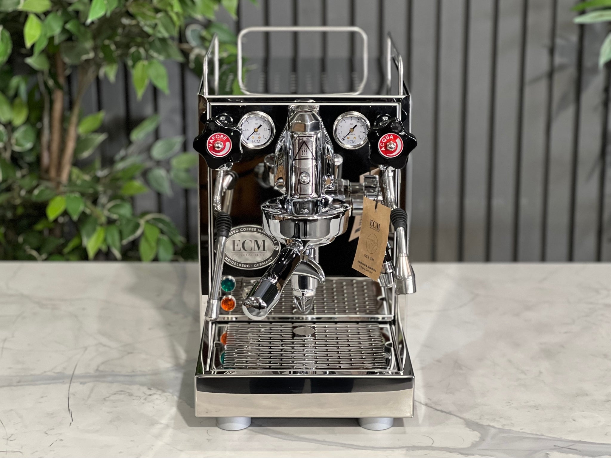ECM Mechanika VI Slim 1 Group Coffee Machine Stainless showcased on a countertop with greenery in the background.