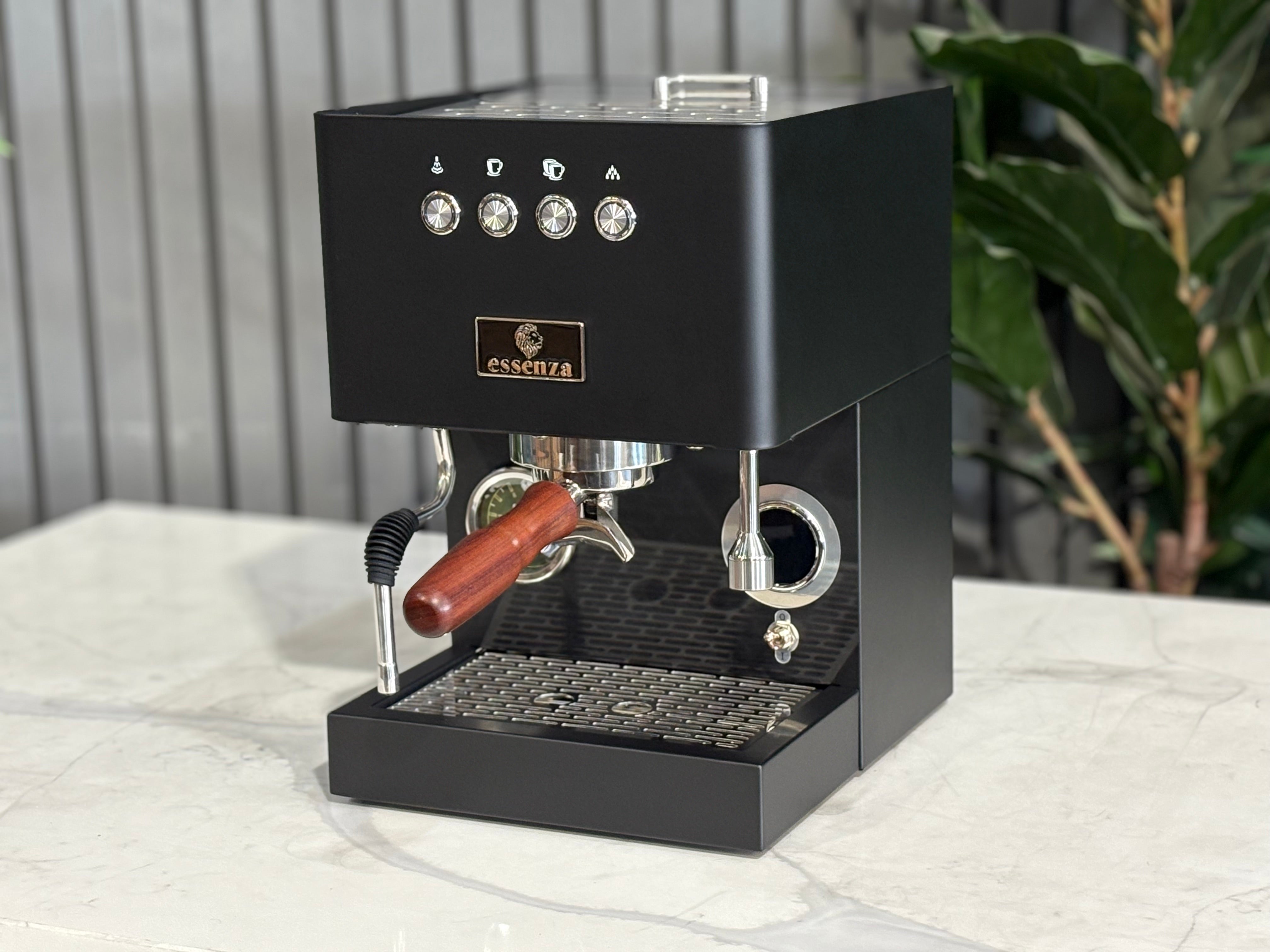 Essenza Nina 1 Group Coffee Machine Stainless on a marble countertop with modern decor.