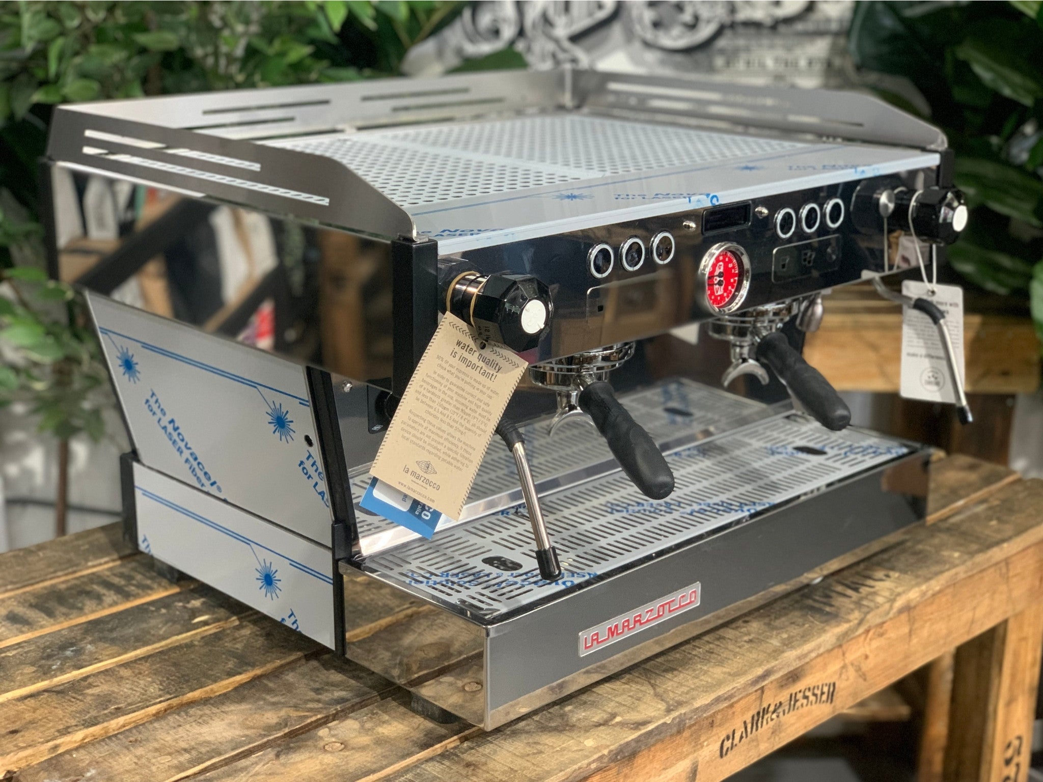 La Marzocco Linea PB 2 Group Coffee Machine Stainless - New angled view showing the stainless steel body, dual group heads with barista lights, dual steam wands, and cup tray.