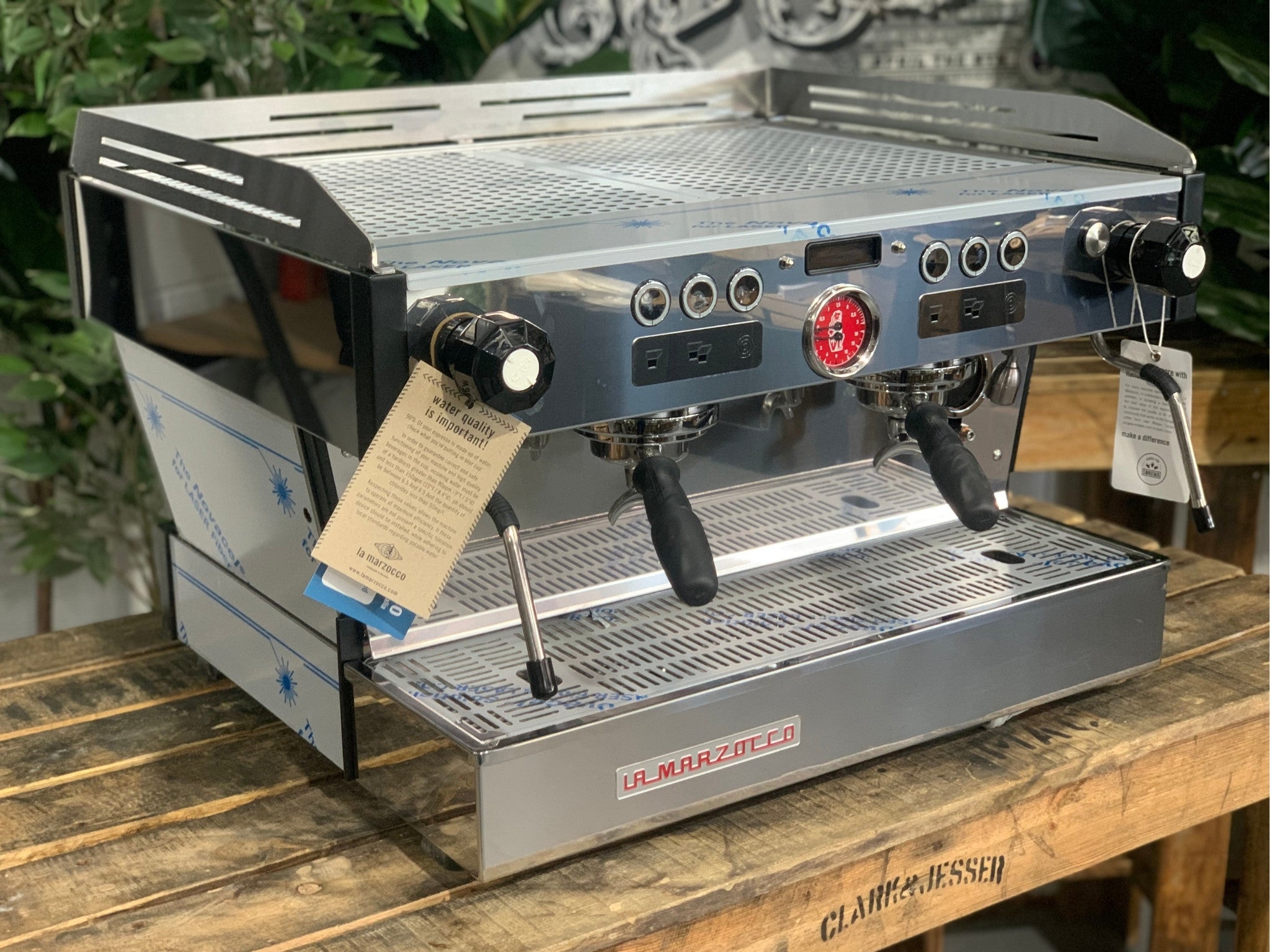 La Marzocco Linea PB 2 Group Coffee Machine Stainless - New angled view showing the stainless steel body, dual group heads with barista lights, dual steam wands, and cup tray.