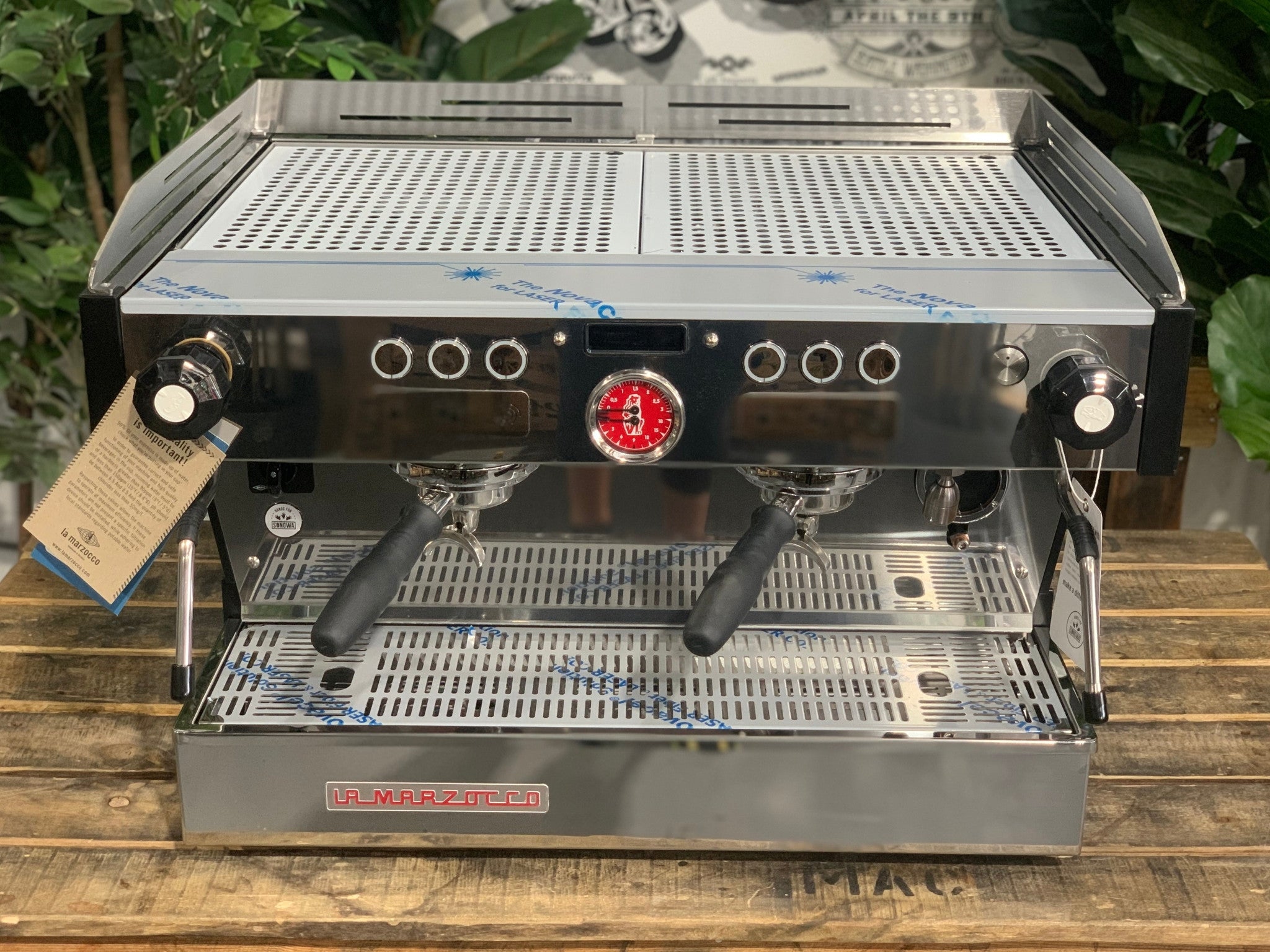 La Marzocco Linea PB 2 Group Coffee Machine Stainless - New front-on view from above showing the stainless steel body, dual group heads with barista lights, cup tray, and dual steam wands.