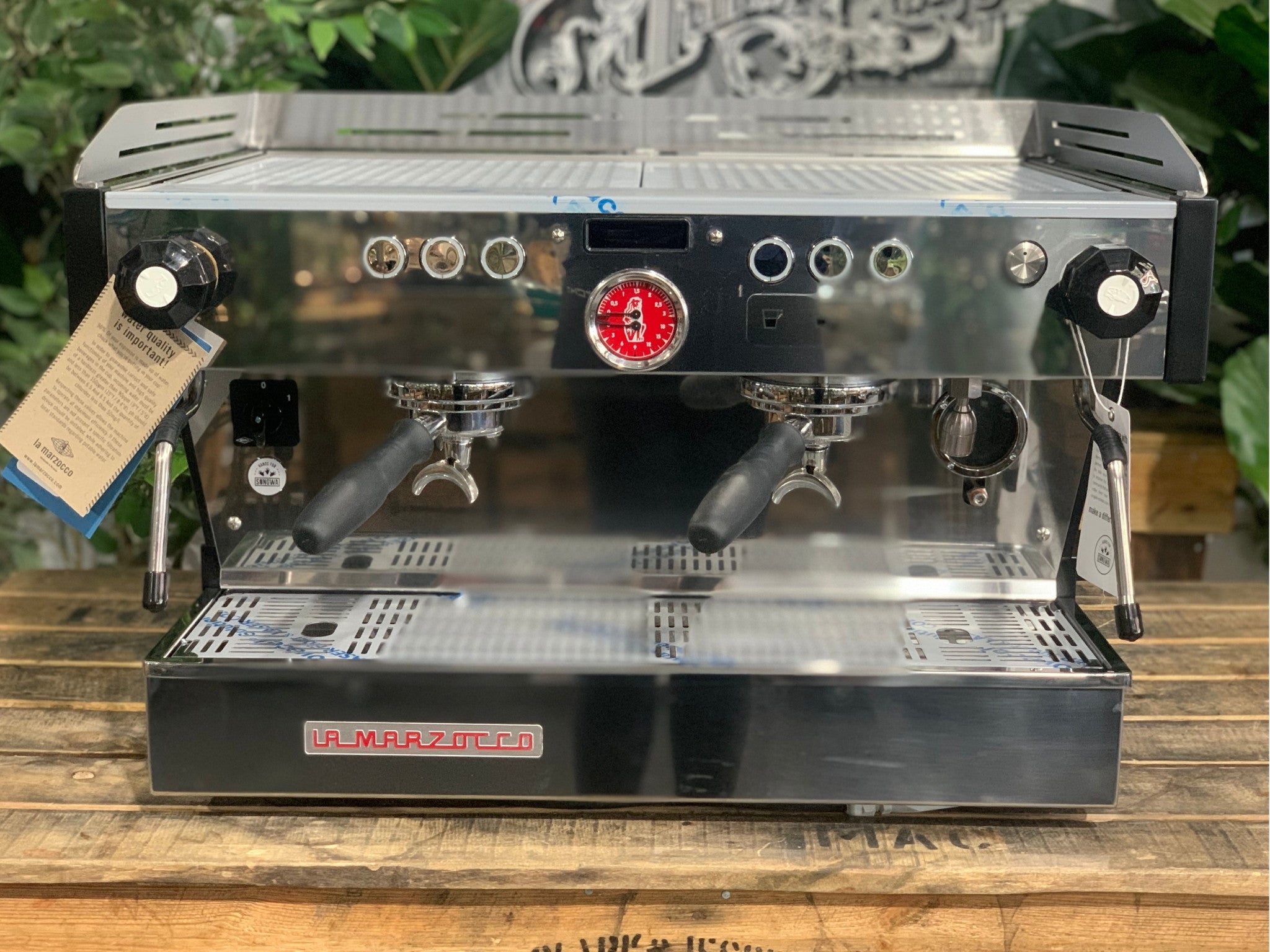 La Marzocco Linea PB 2 Group Coffee Machine Stainless - New front-on view highlighting the dual group heads with barista lights, dual steam wands, programmable buttons, and stainless steel body.