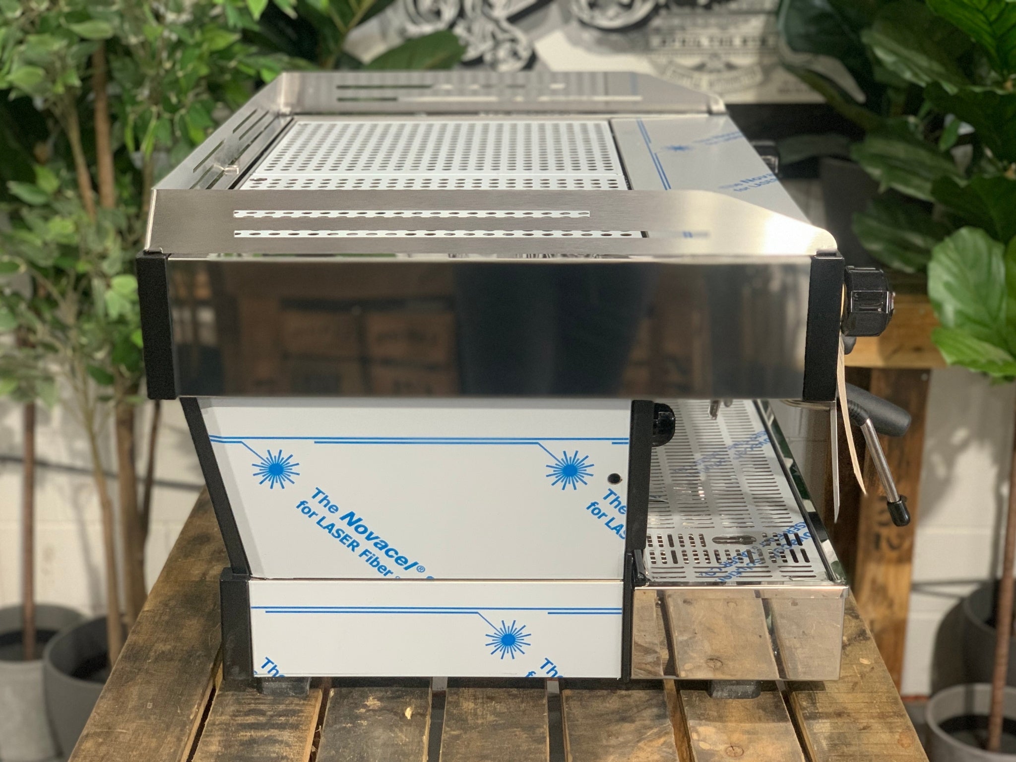 La Marzocco Linea PB 2 Group Coffee Machine Stainless - New side view highlighting the stainless steel body, dual group heads with barista lights, and dual steam wands, with internal dual boilers hidden for reliable espresso features.