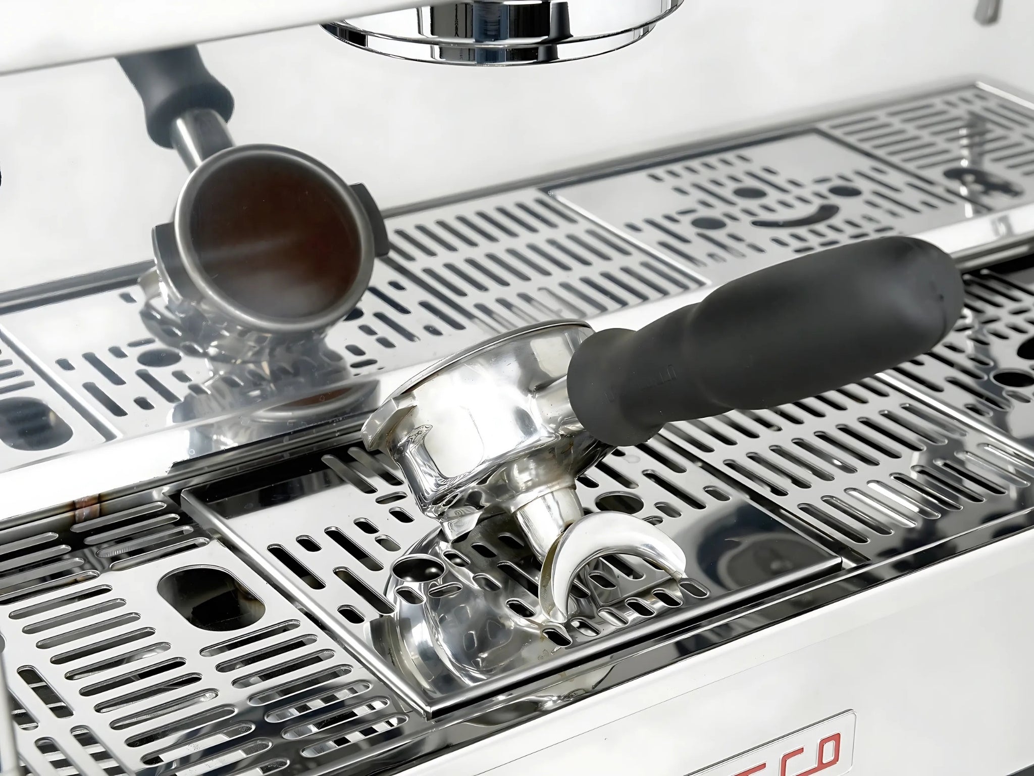 La Marzocco Linea PB ABR 2 Group Coffee Machine Stainless - New close-up of a group head resting on the integrated ABR drip tray, showing the stainless steel body and precision espresso features in a full-size image.