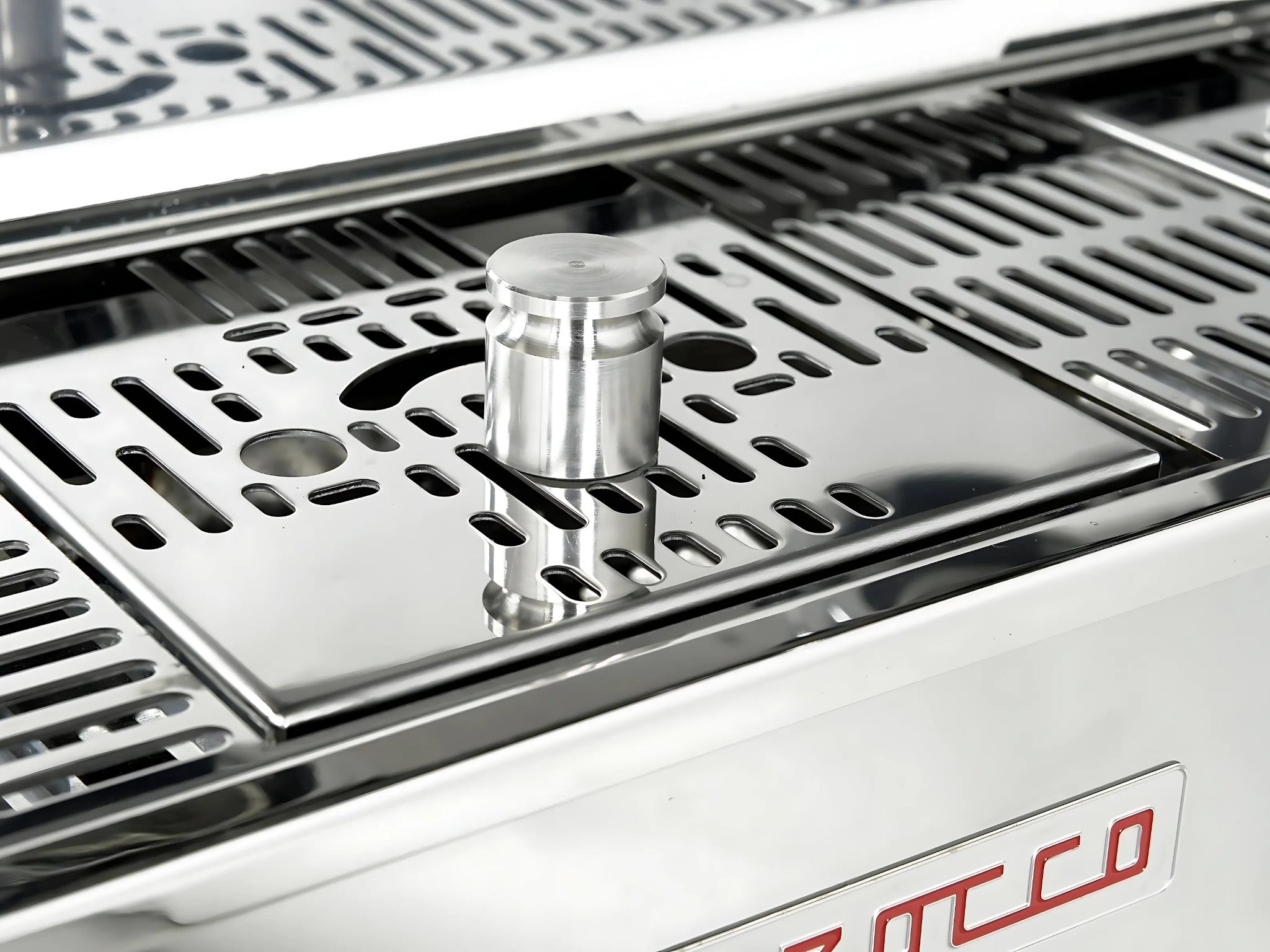 La Marzocco Linea PB ABR 3 Group Coffee Machine Stainless - New, close-up showing a weight resting on the ABR integrated drip tray scales beneath the group heads, stainless steel body visible.