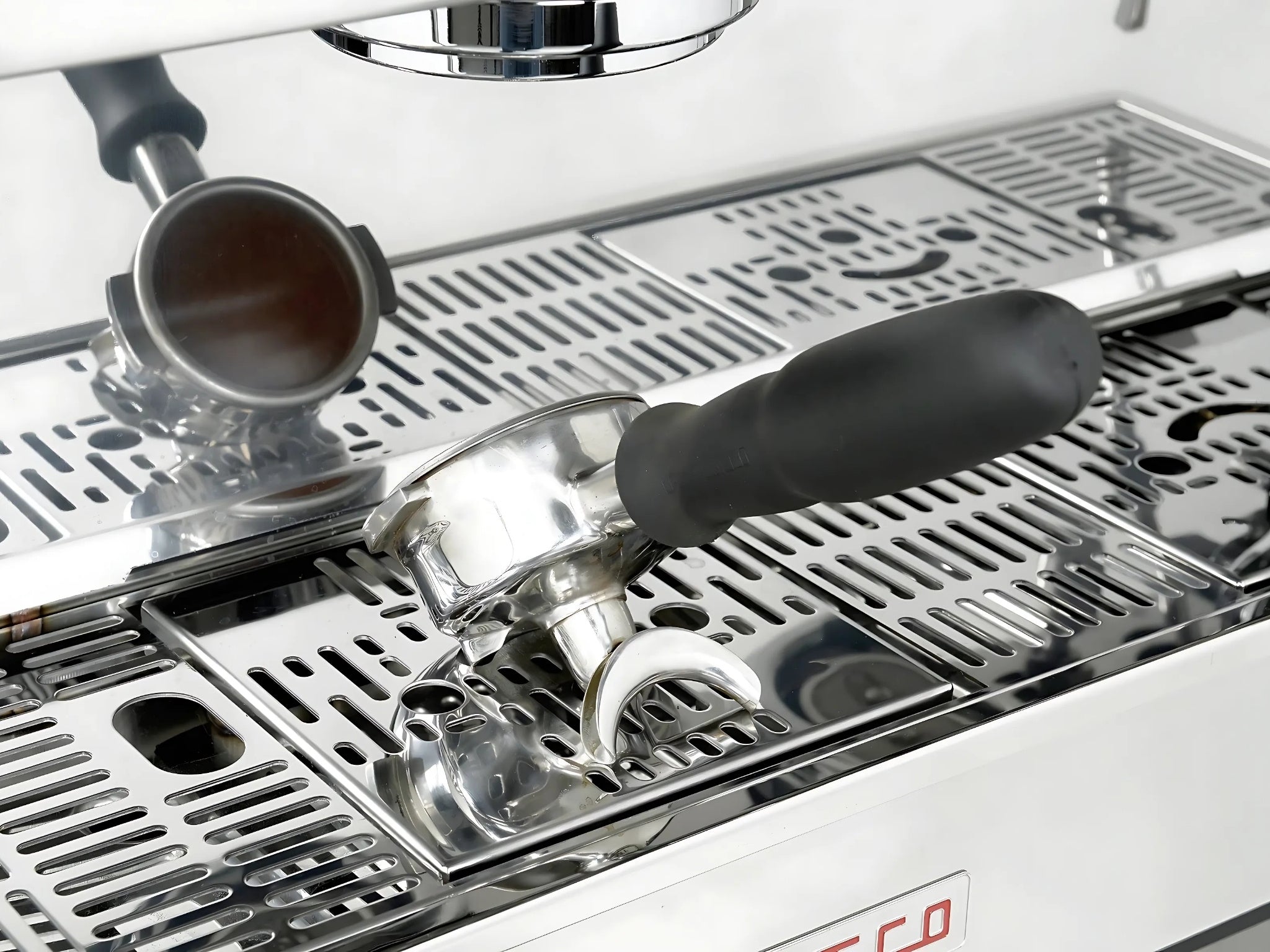 La Marzocco Linea PB ABR 3 Group Coffee Machine Stainless - New close-up of a group head resting on the integrated ABR drip tray, showing the stainless steel body and precision espresso features in a full-size image.