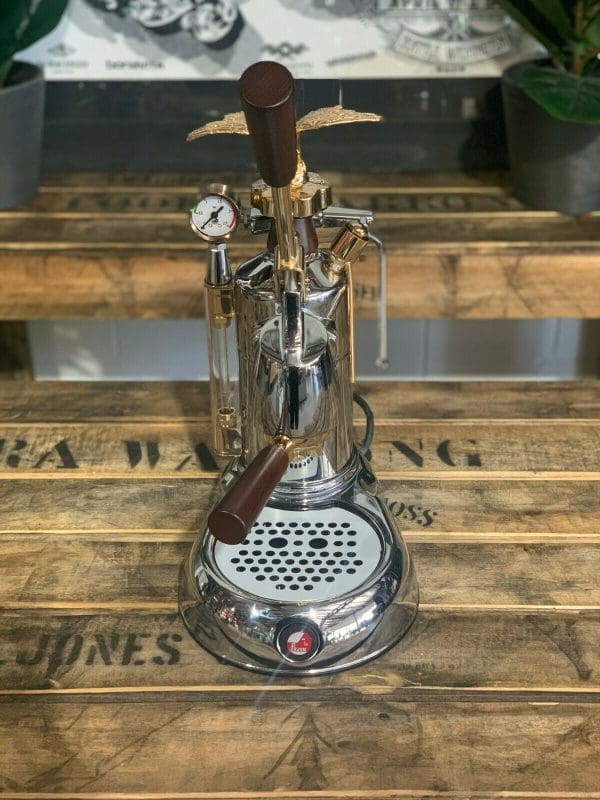 La Pavoni Expo 2015 1 Group Espresso Machine showcasing elegant design and craftsmanship on a wooden countertop.