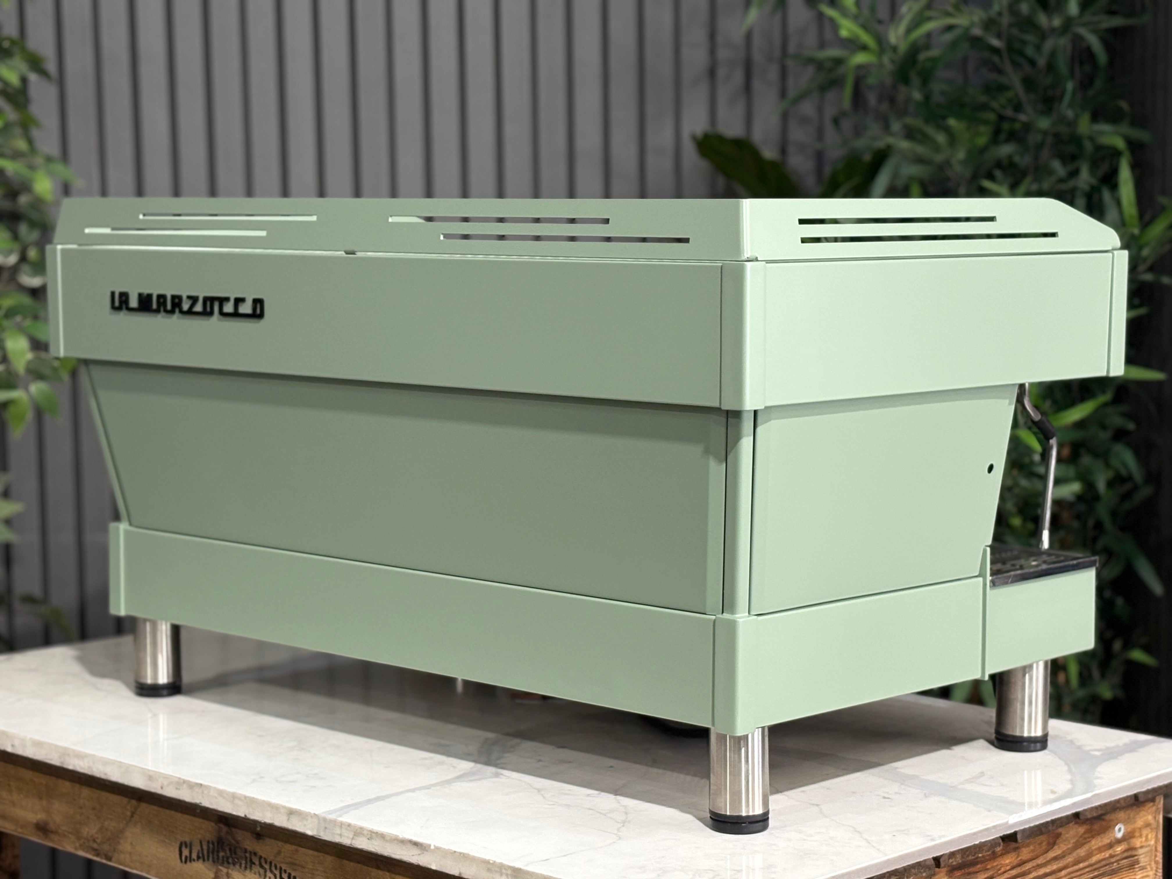 La Marzocco Linea PB 3 Group Coffee Machine Mint Green - Used displayed in a café setting on a marble table.