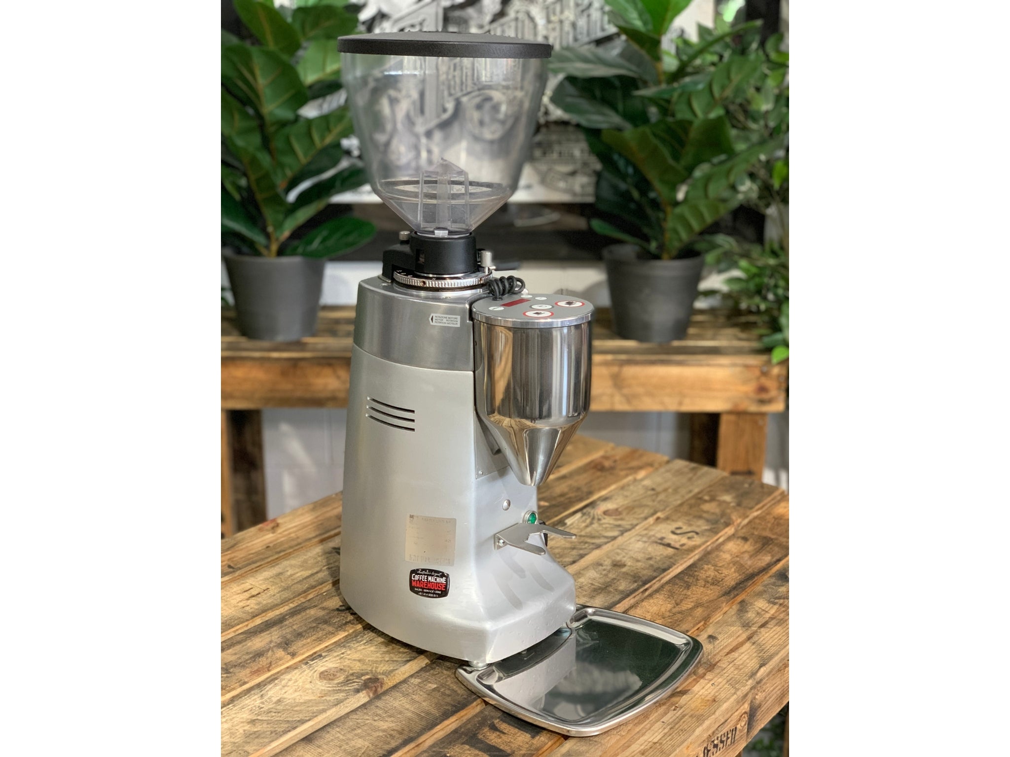 Mazzer Kony Electronic Silver Coffee Grinder on a wooden bench