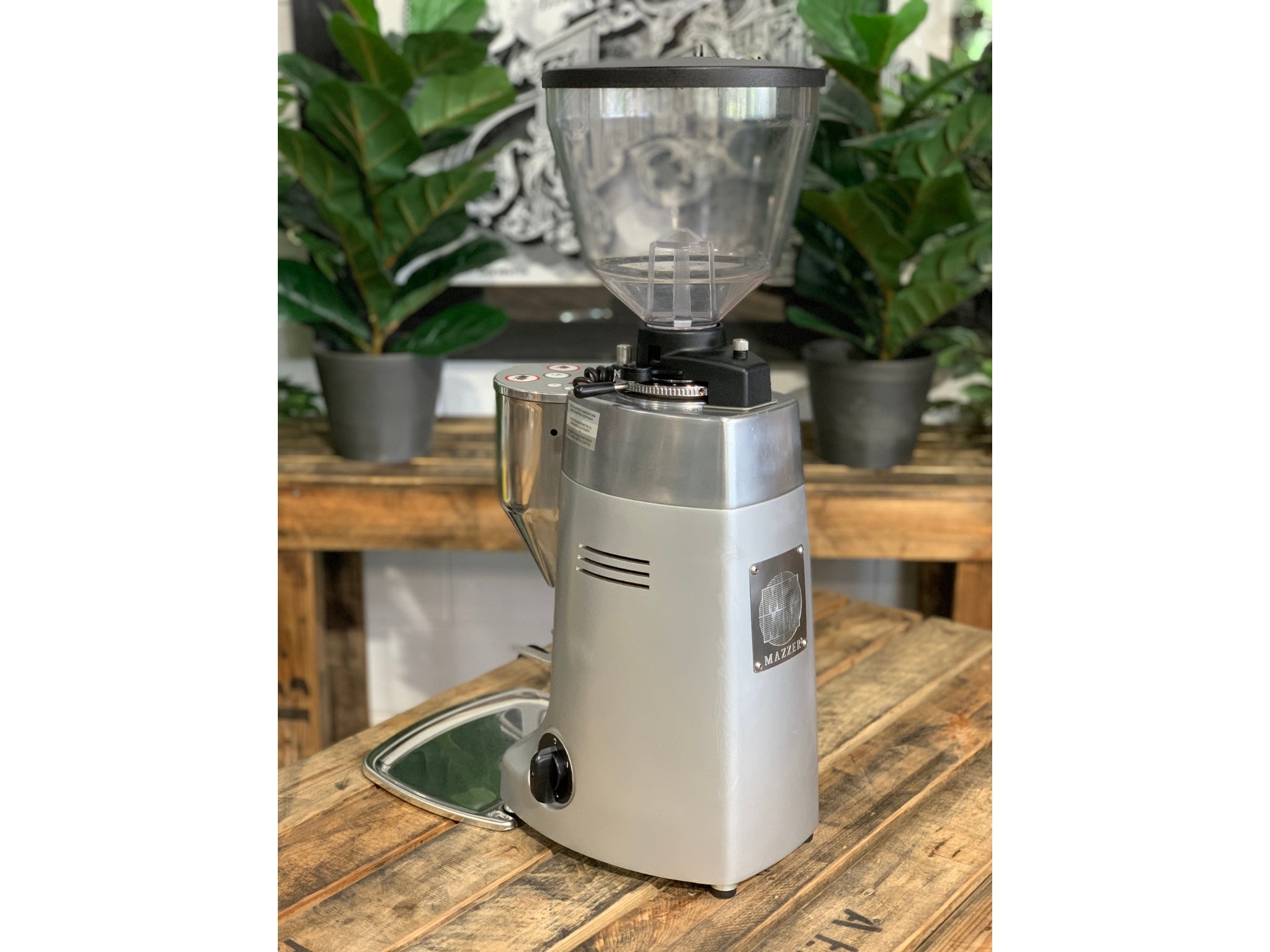 Mazzer Kony Electronic Silver Coffee Grinder on a wooden bench