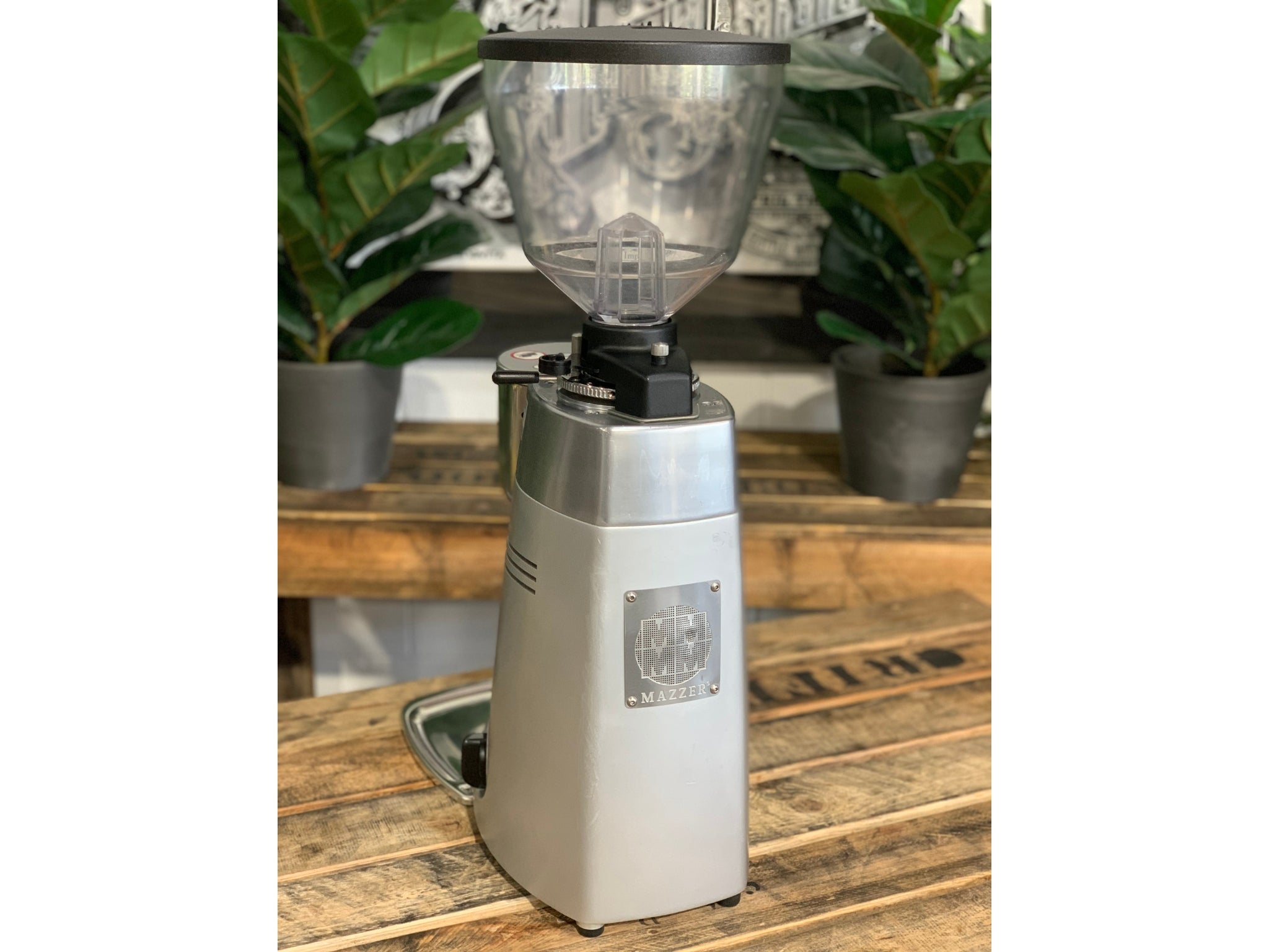 Mazzer Kony Electronic Silver Coffee Grinder on a wooden bench