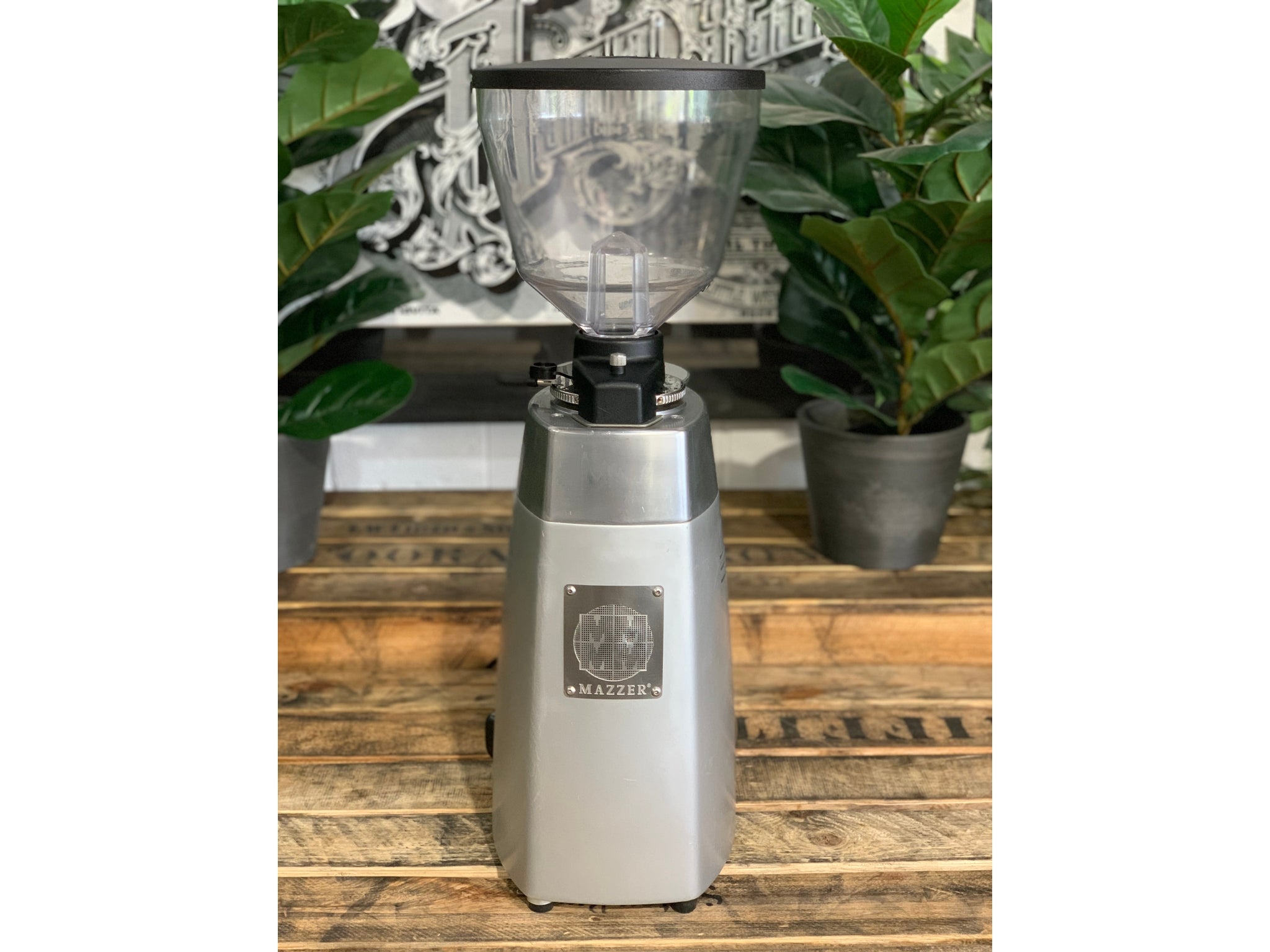 Mazzer Kony Electronic Silver Coffee Grinder on a wooden bench