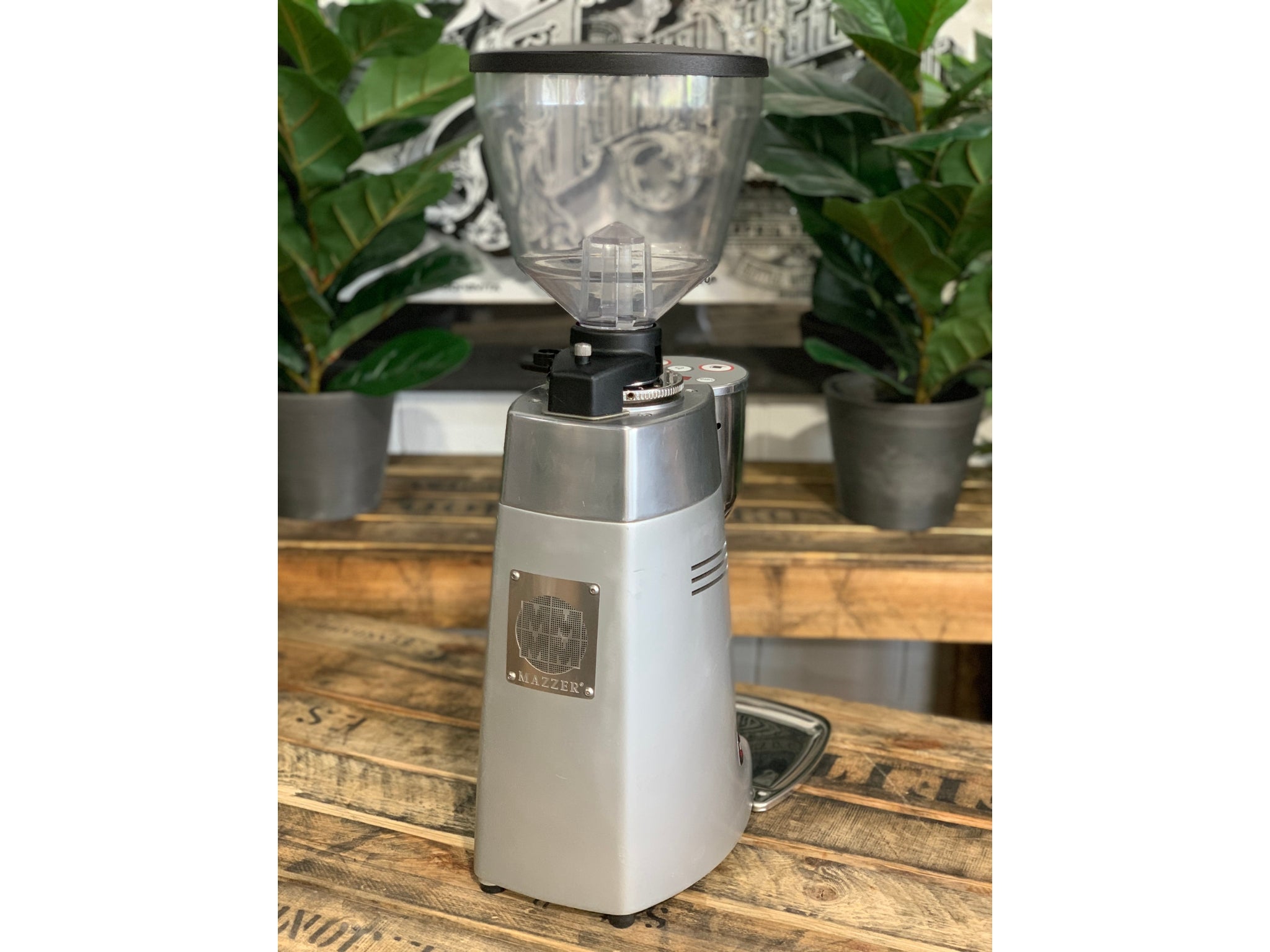 Mazzer Kony Electronic Silver Coffee Grinder on a wooden bench