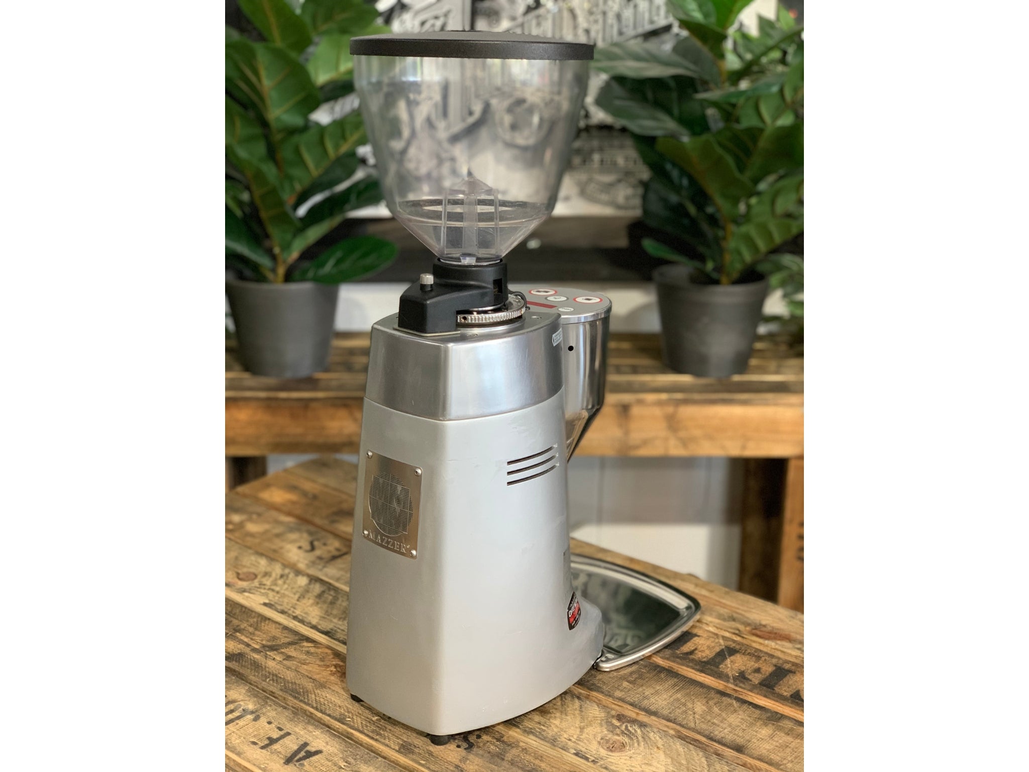 Mazzer Kony Electronic Silver Coffee Grinder on a wooden bench