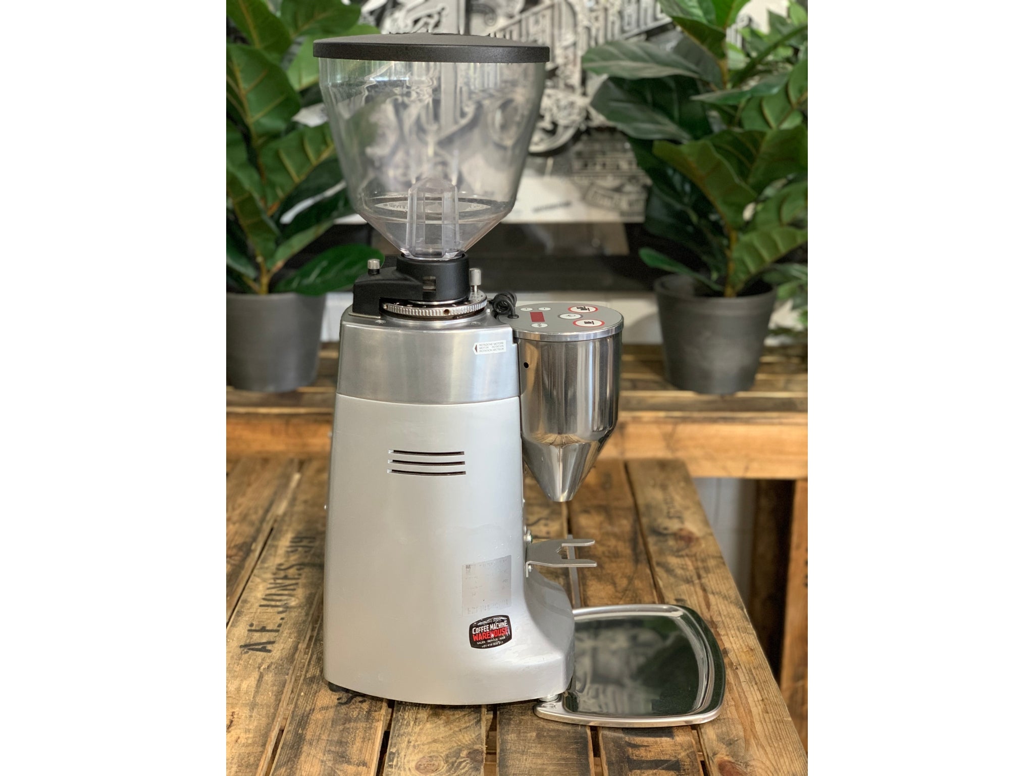 Mazzer Kony Electronic Silver Coffee Grinder on a wooden bench