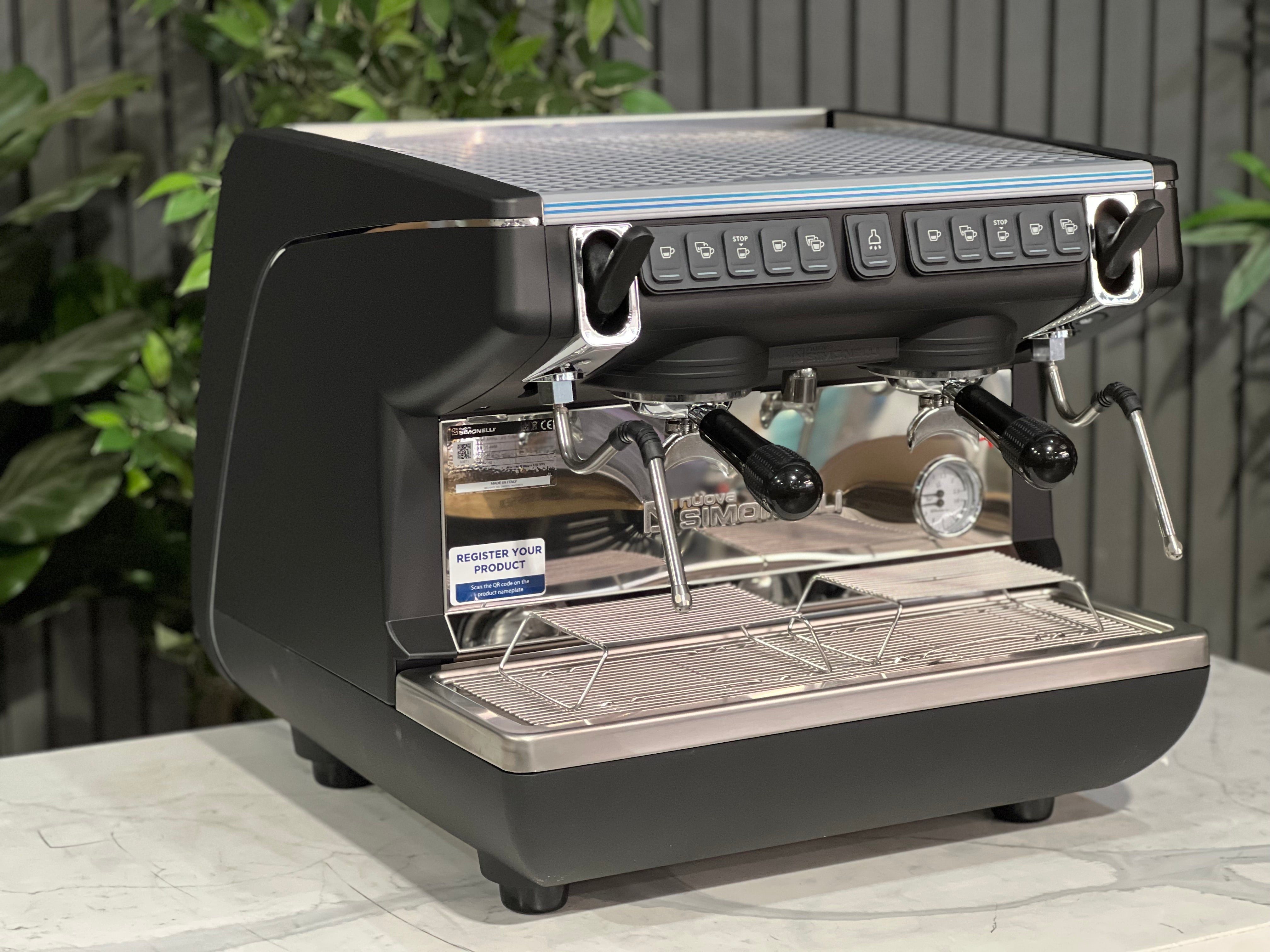 Nuova Simonelli Appia Life Compact Black 2 Group Espresso Machine on a countertop with a modern design.