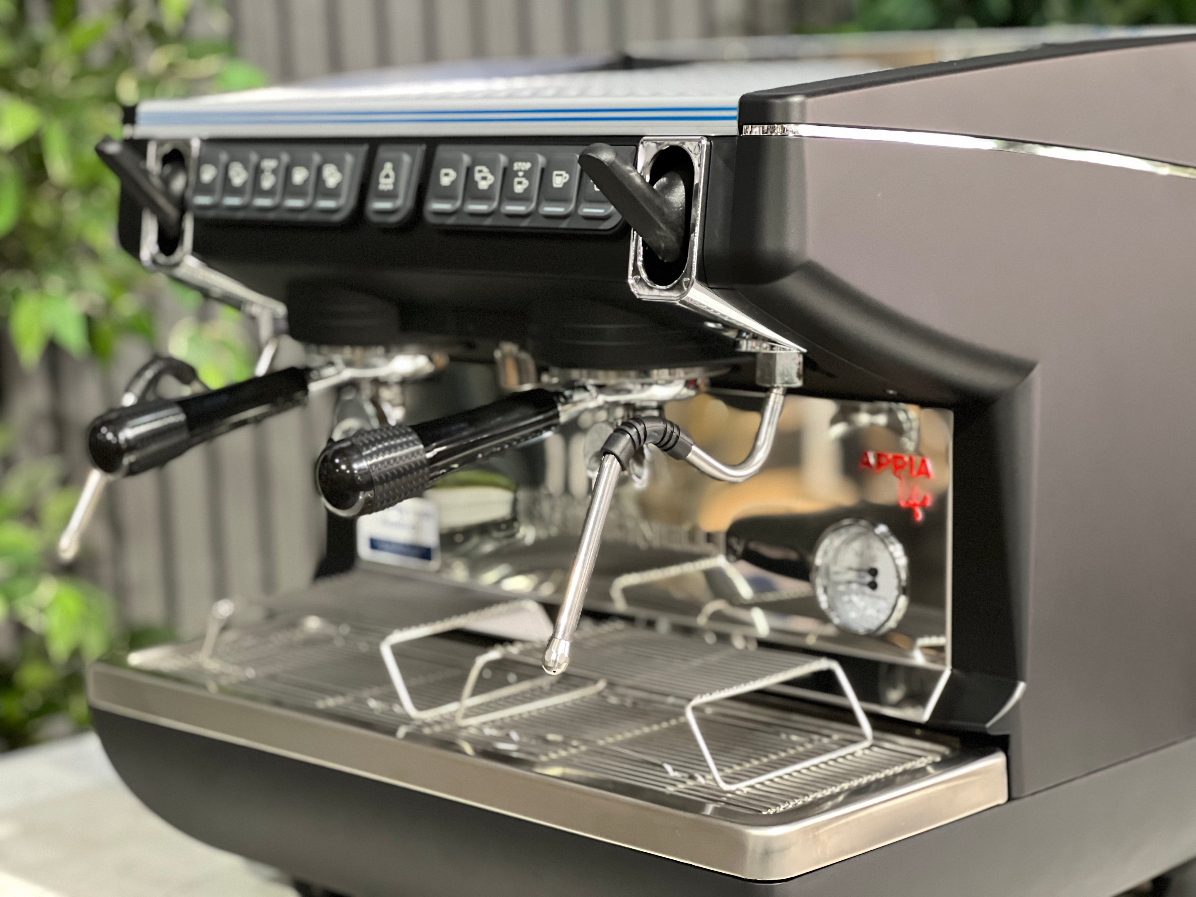 Nuova Simonelli Appia Life Compact Black 2 Group Espresso Machine showcasing the controls and brew group.