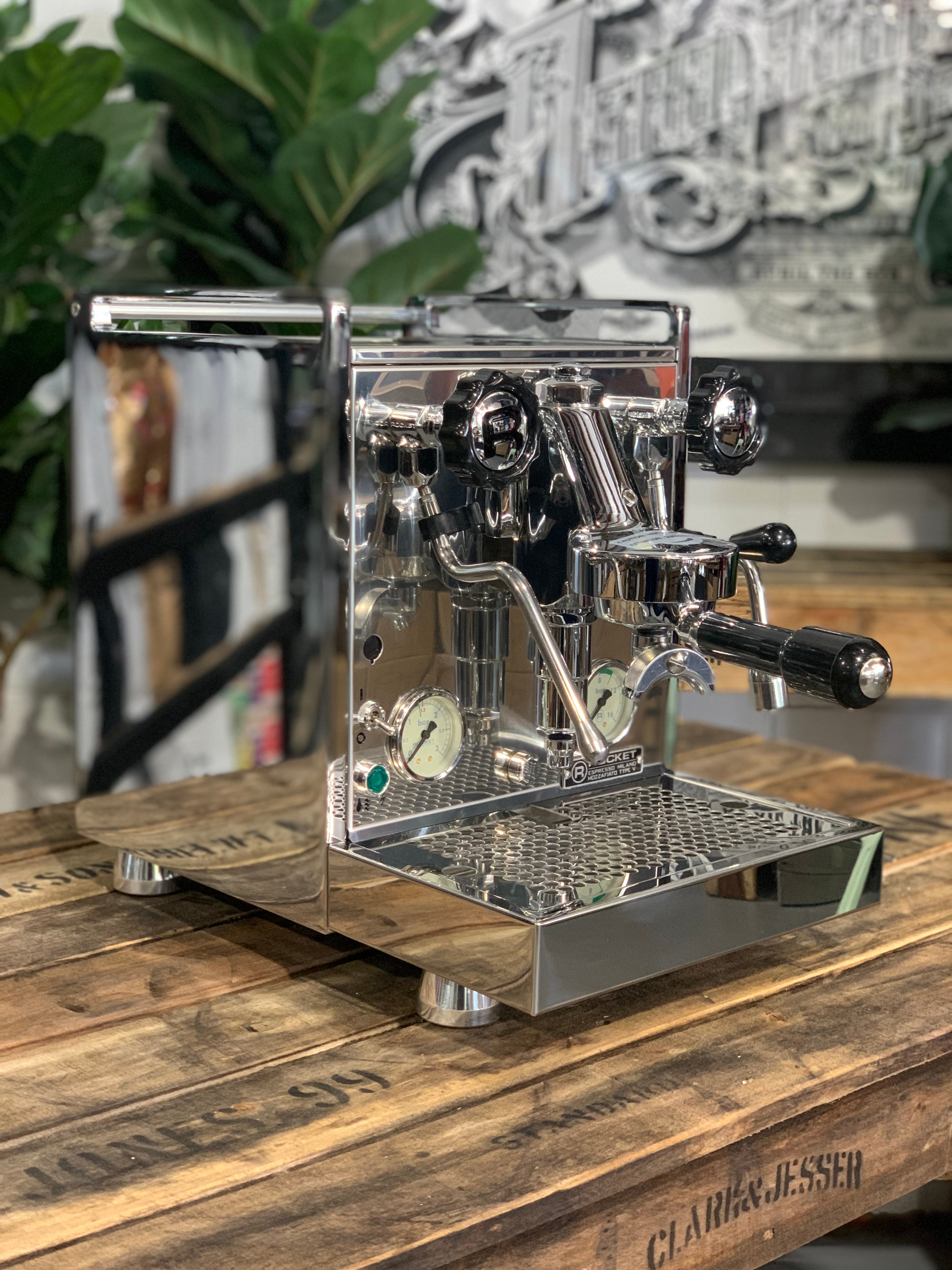 Rocket Mozzafiato Cronometro V 1 Group Coffee Machine - New with stainless steel finish displayed on wooden surface.