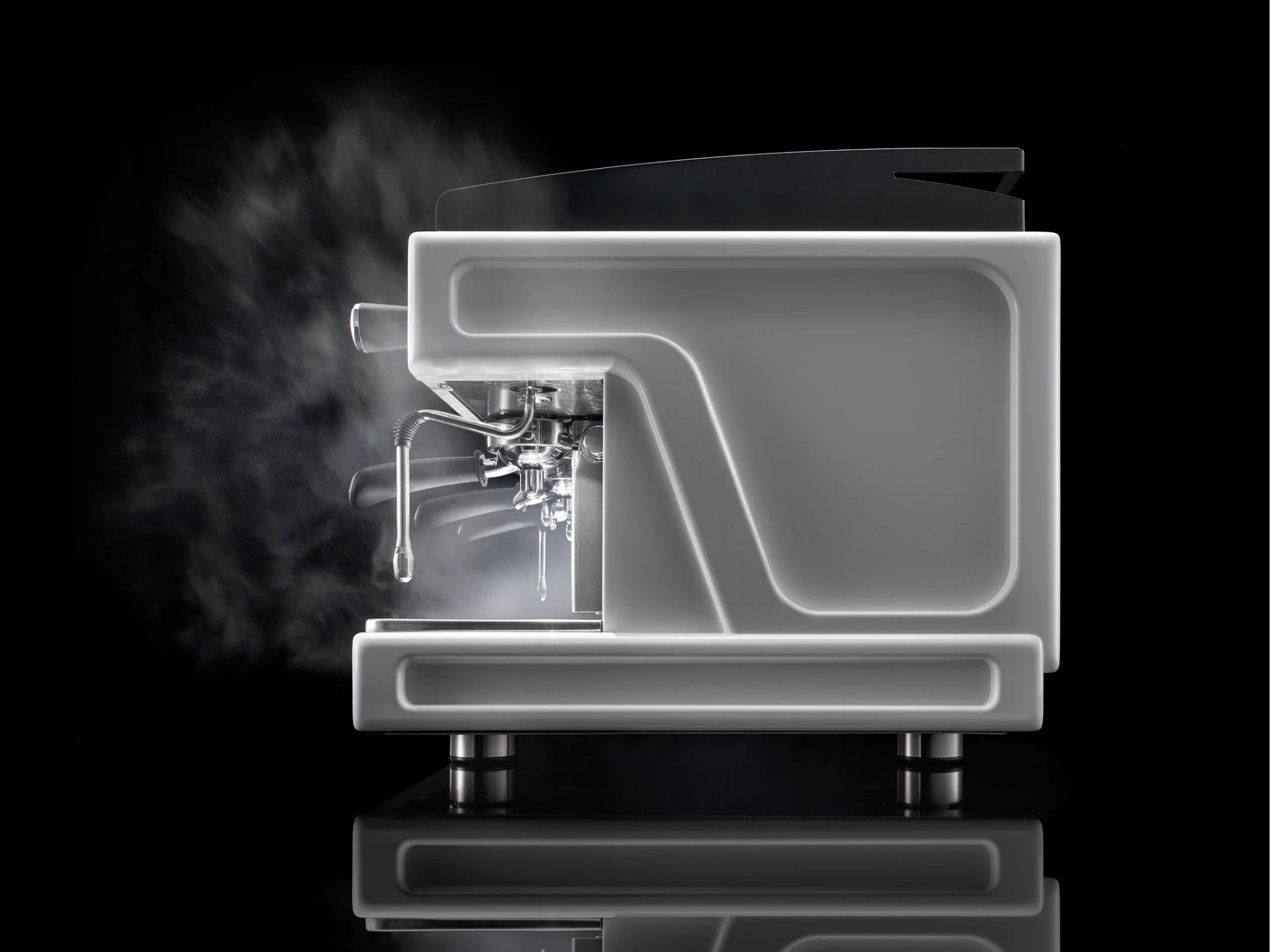 Wega Airy EVD 3 Group Coffee Machine White - New side-on view set against a black background, with steam visibly rising from the stainless steel steam wand. The matte white body stands out in contrast, highlighting the espresso coffee machine’s powerful steam performance and elegant design.