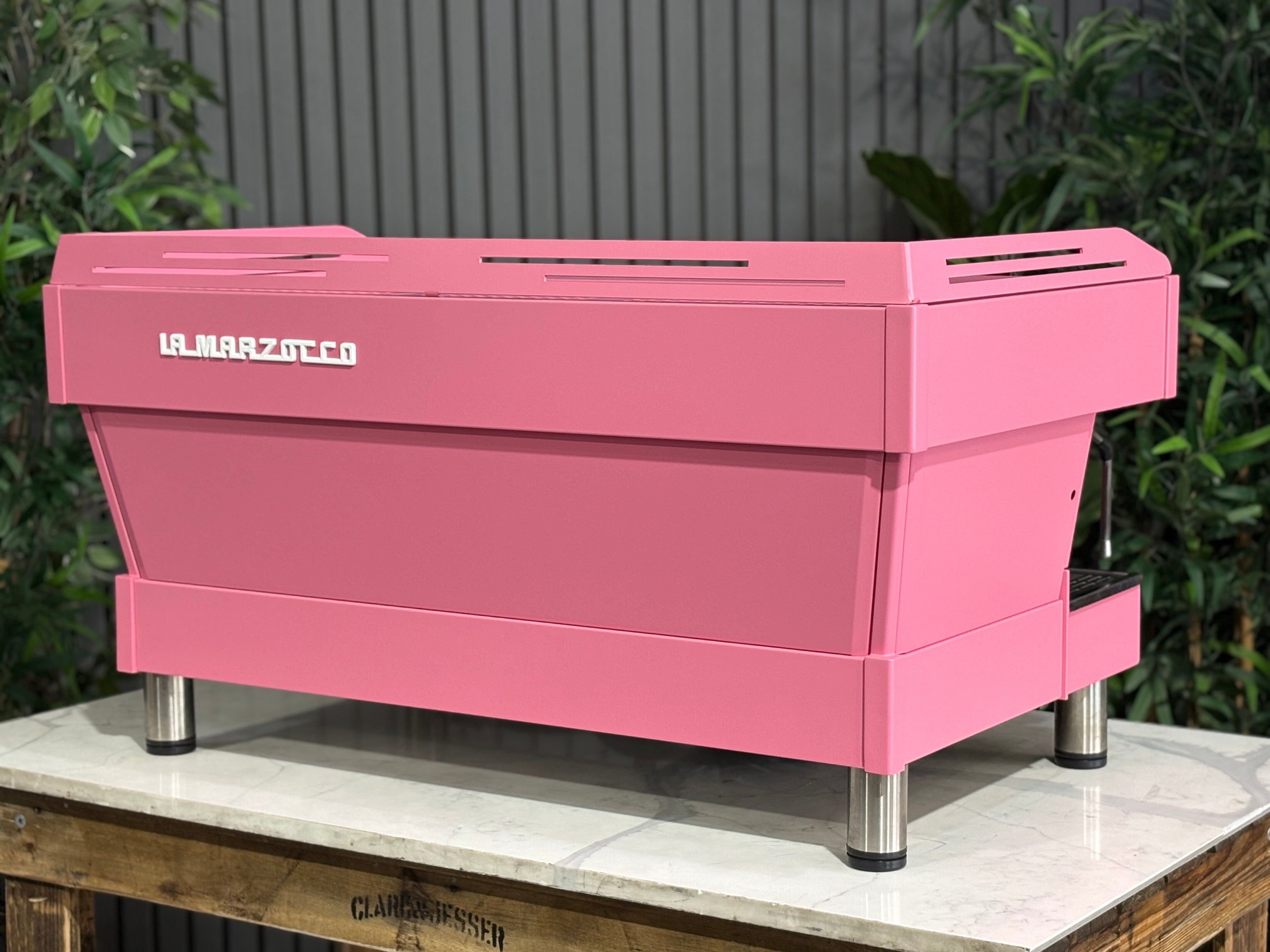 La Marzocco Linea PB 3 Group Coffee Machine Dark Pink - Used displayed against a backdrop of greenery.