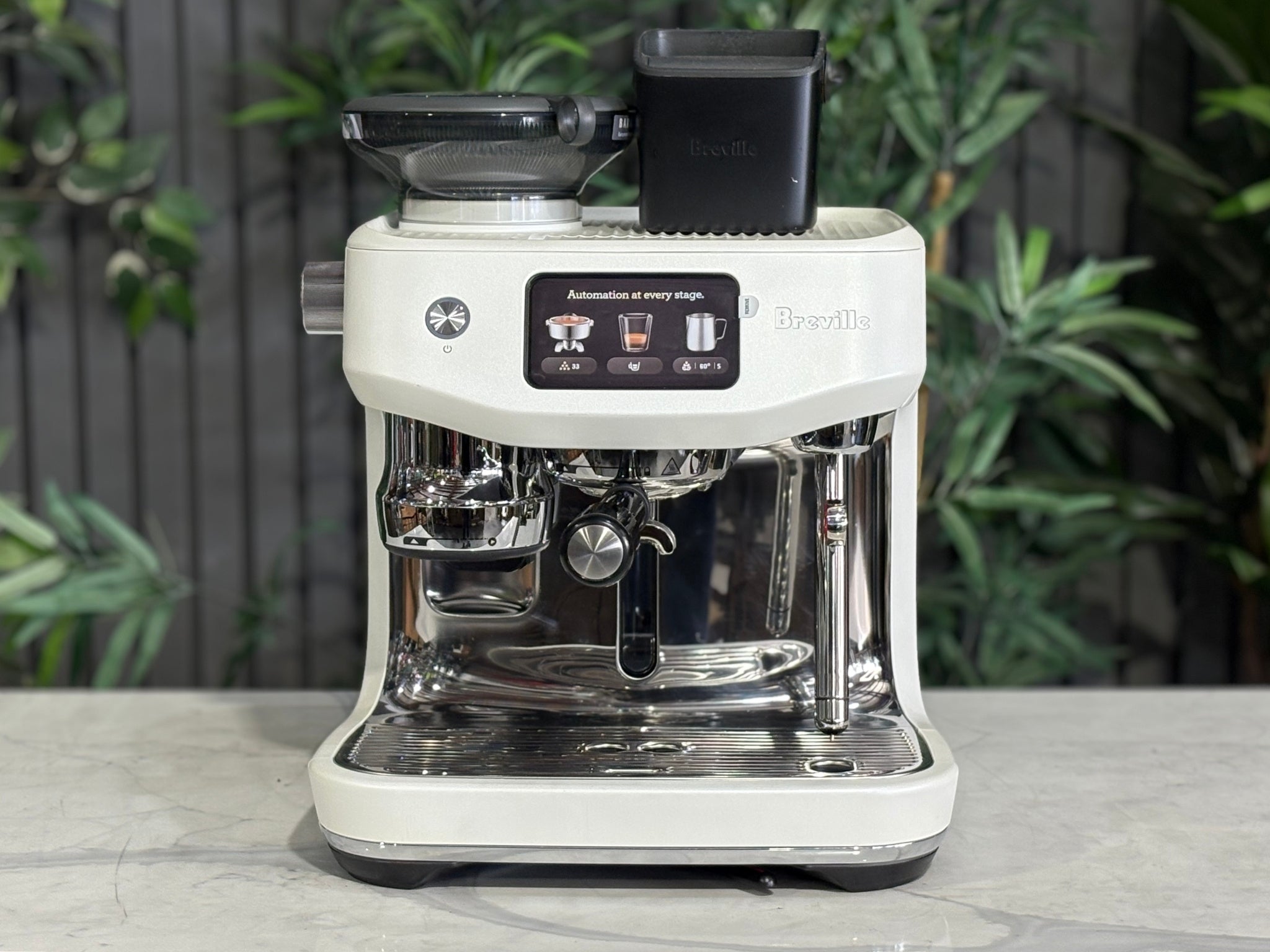 Breville Oracle Jet 1 Group Coffee Machine White - New, front view on a marble bench, highlighting the 1 group espresso head, AutoMilQ milk steamer, touch screen controls, and sleek white body.