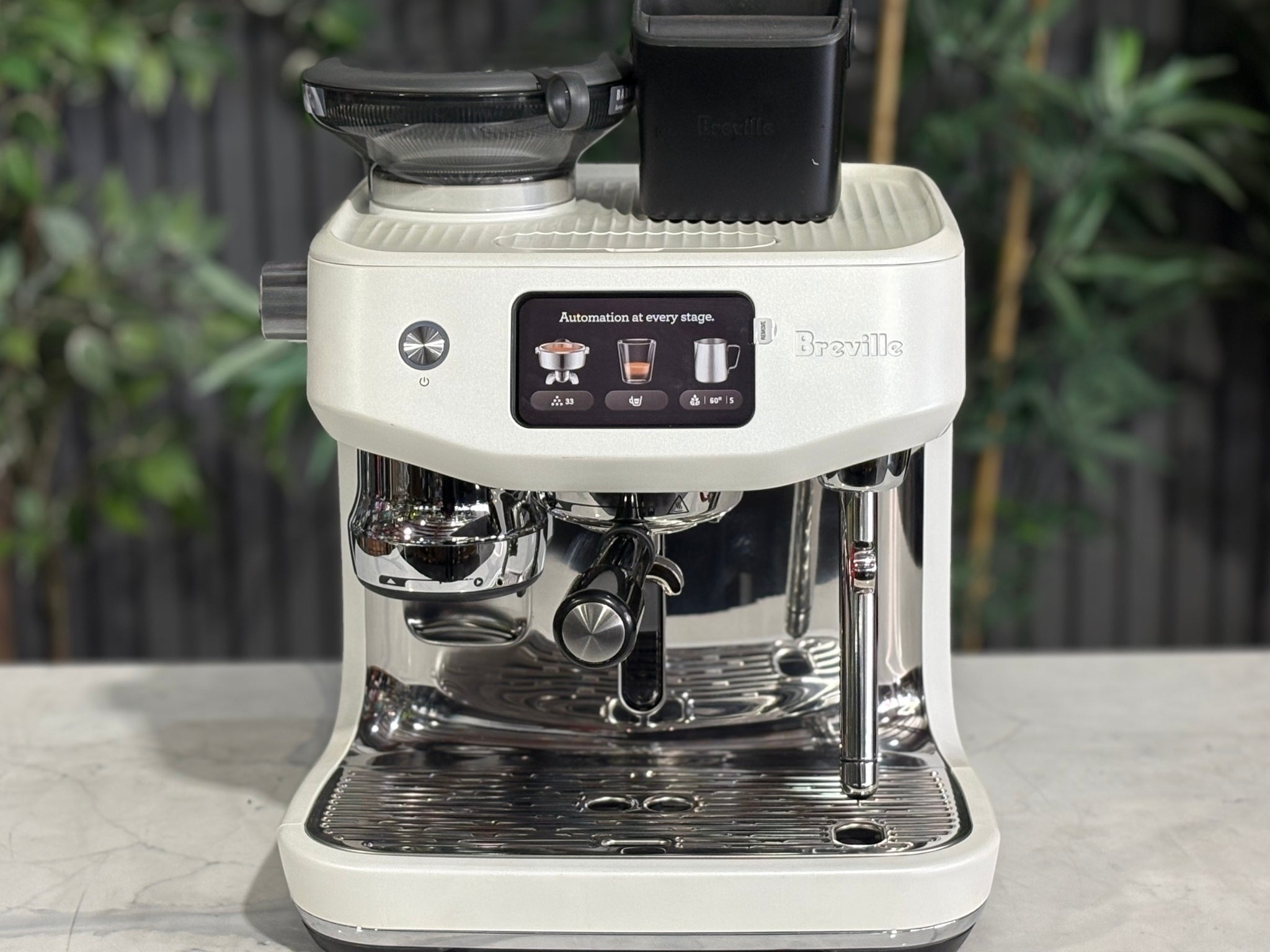 Breville Oracle Jet 1 Group Coffee Machine White - New, close-up front view on a marble bench, detailing the touch screen controls, milk steamer wand, and 1 group espresso head.