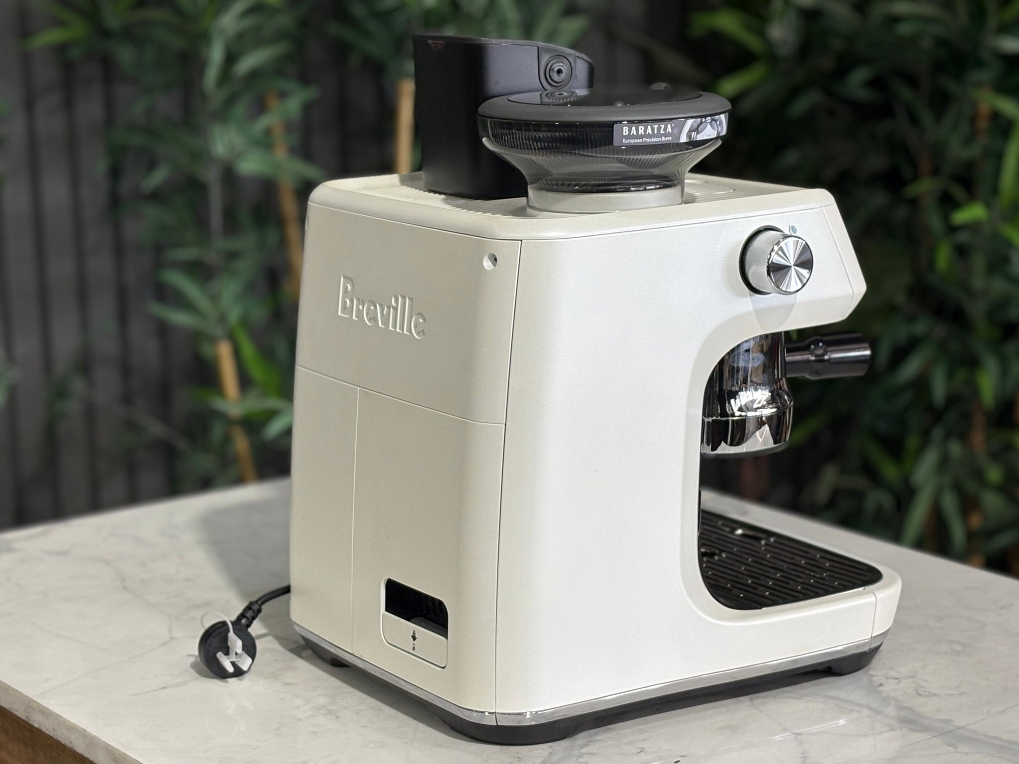 Breville Oracle Jet 1 Group Coffee Machine White - New, side view on a marble bench, highlighting the white body and AutoMilQ milk steamer of this 1 group espresso coffee machine.