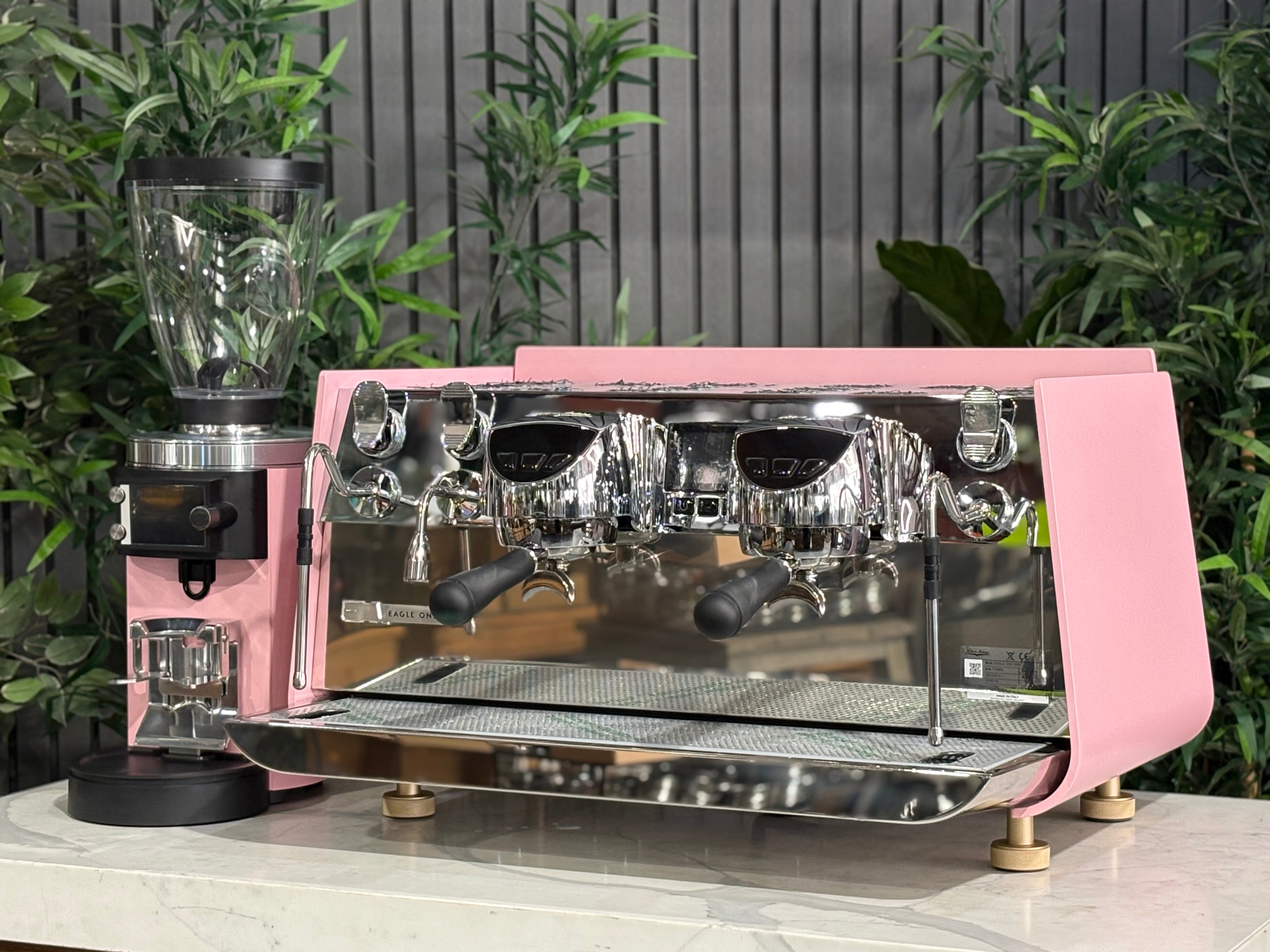 Victoria Arduino Eagle One 2 Group Coffee Machine Custom Pink & Gold with Mahlkönig E65 GBS Grinder on display