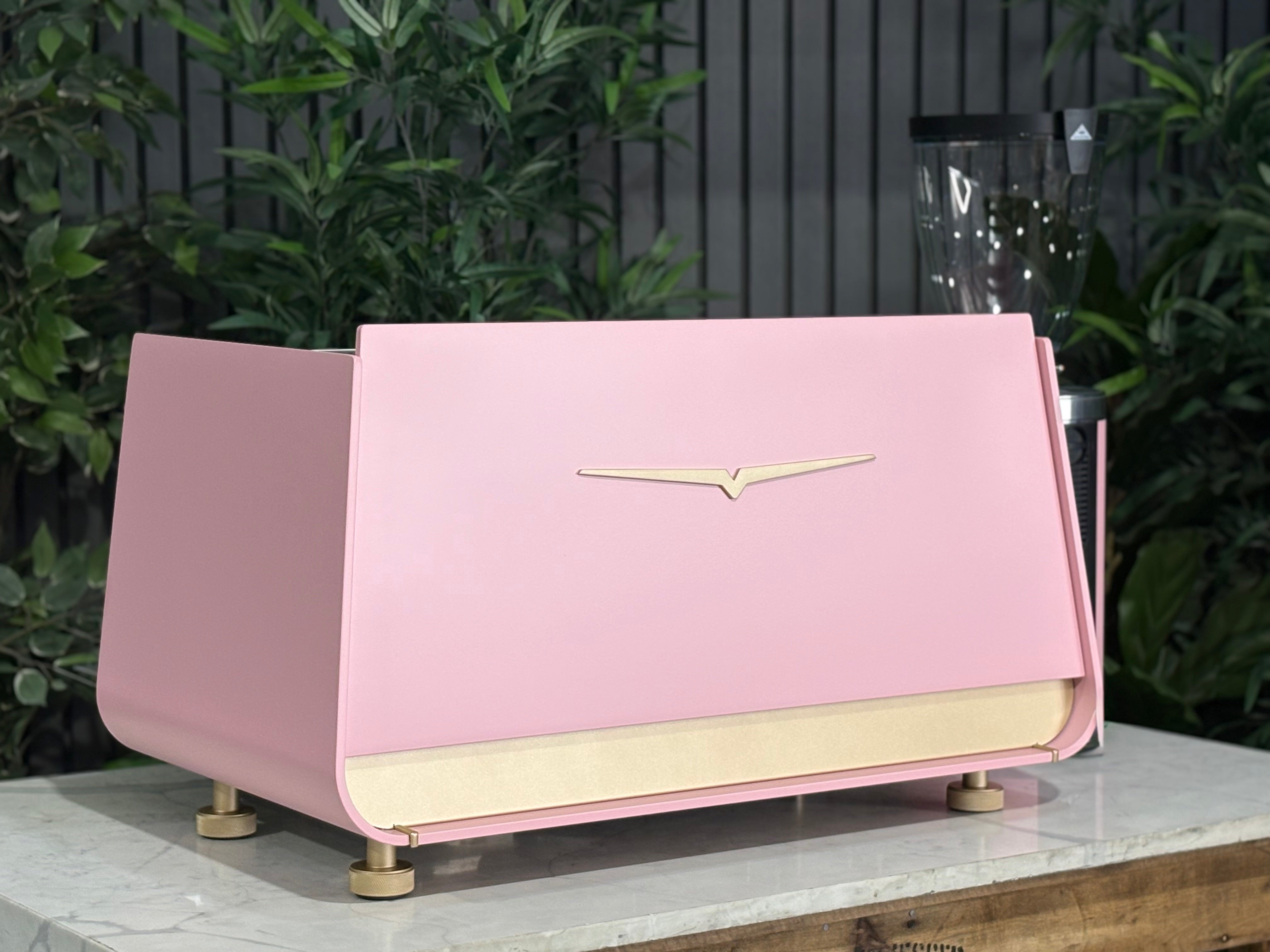 Victoria Arduino Eagle One 2 Group Coffee Machine Custom Pink & Gold on display with modern design elements.
