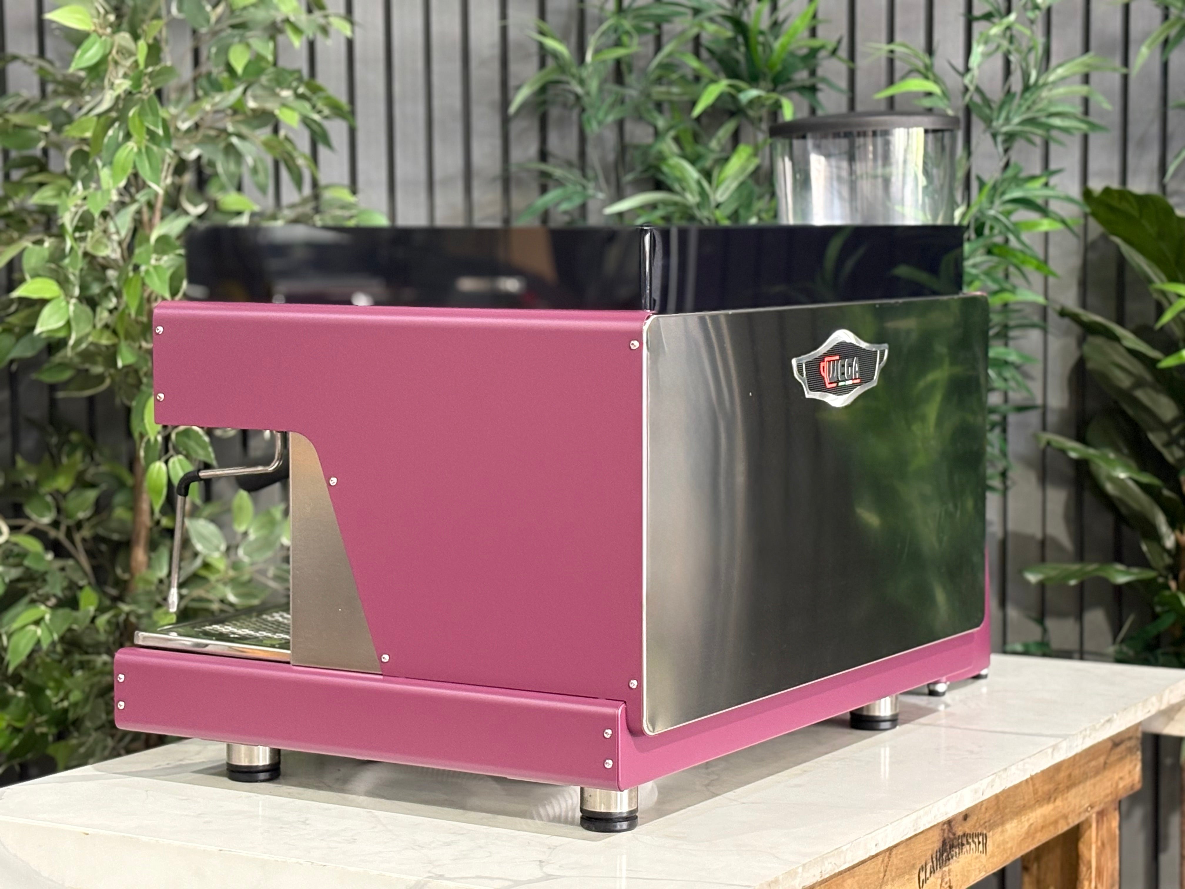 Wega Pegaso EVD 2 Group Coffee Machine & Mazzer Major Electronic Grinder in deep pink color.