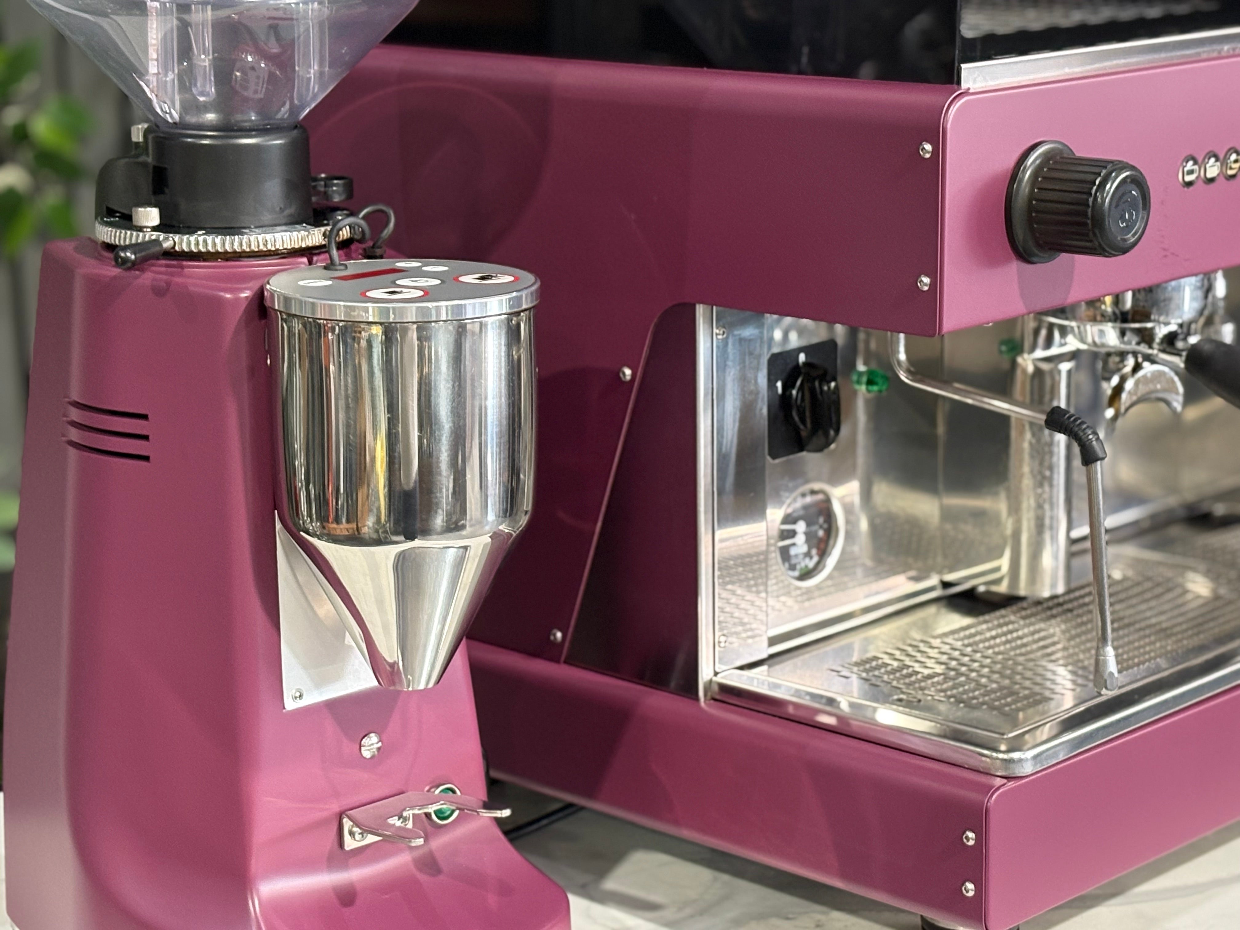 Wega Pegaso EVD 2 Group Coffee Machine & Mazzer Major Electronic Grinder close-up detail in deep pink, showing the grinder.