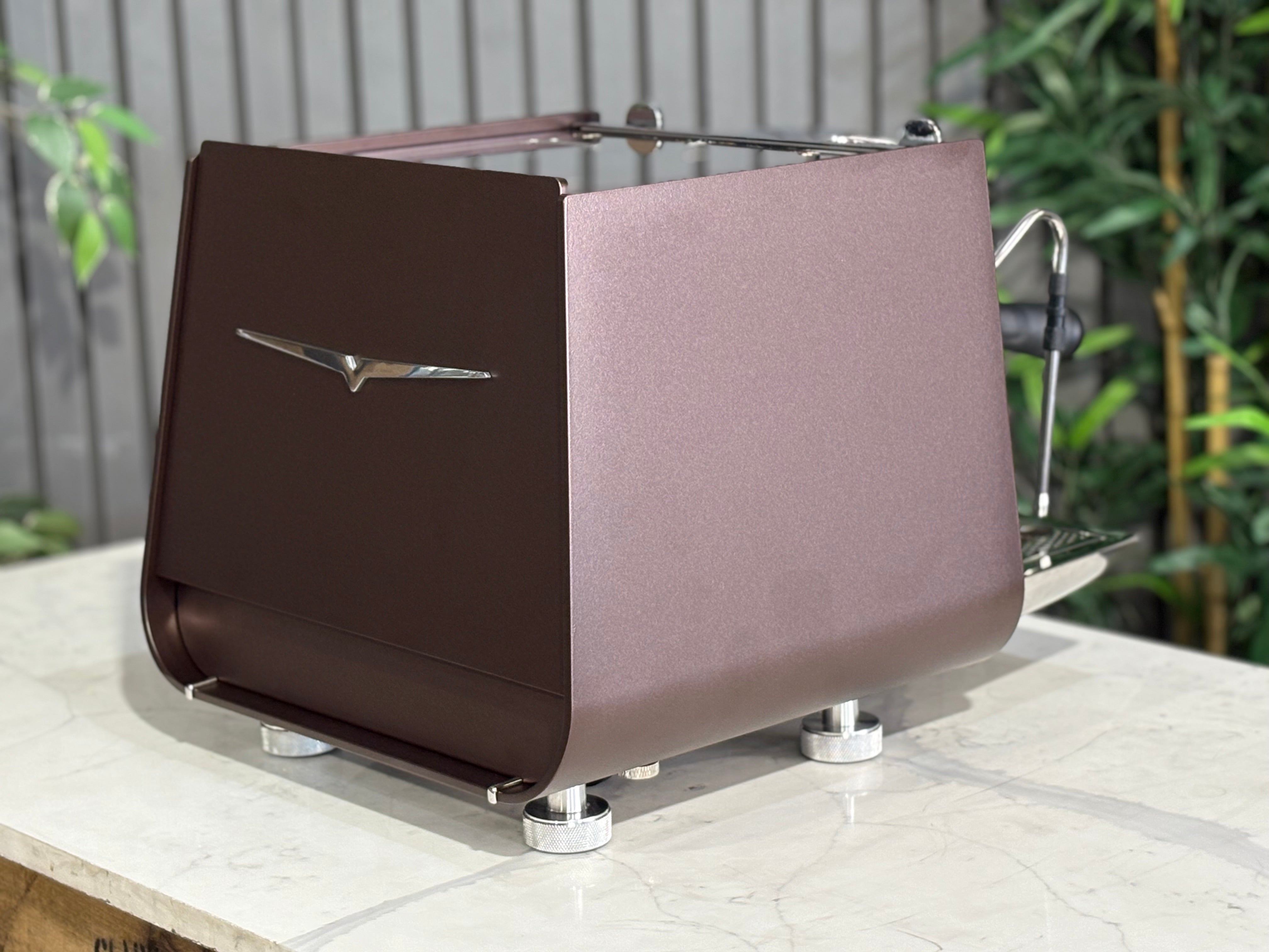 Victoria Arduino Eagle One Prima 1 Group Espresso Machine in burnished copper finish on a marble countertop.