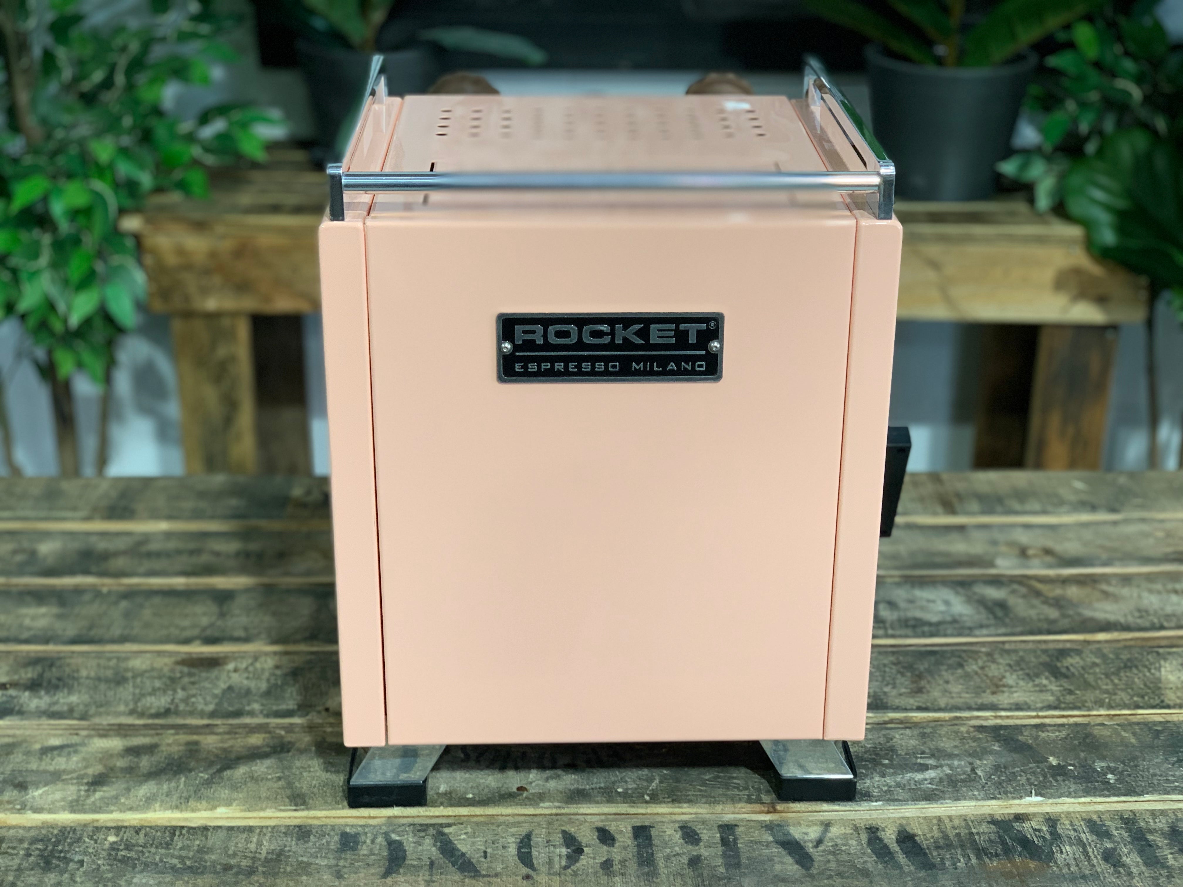 Rocket Cinquantotto R58 1 Group Coffee Machine - New in pink finish on a wooden table.