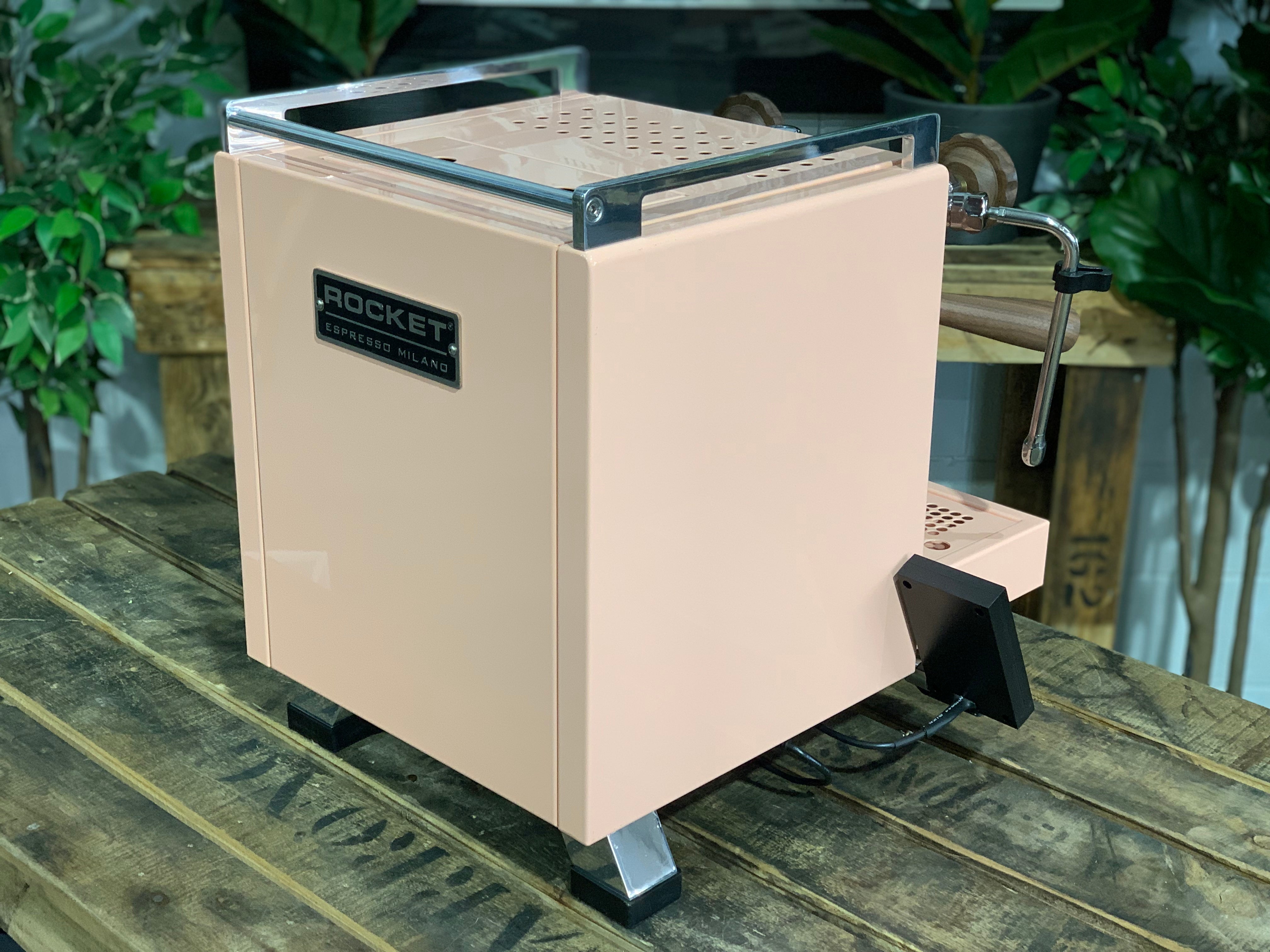 Rocket Cinquantotto R58 1 Group Coffee Machine - New in pink finish displayed on a wooden table.