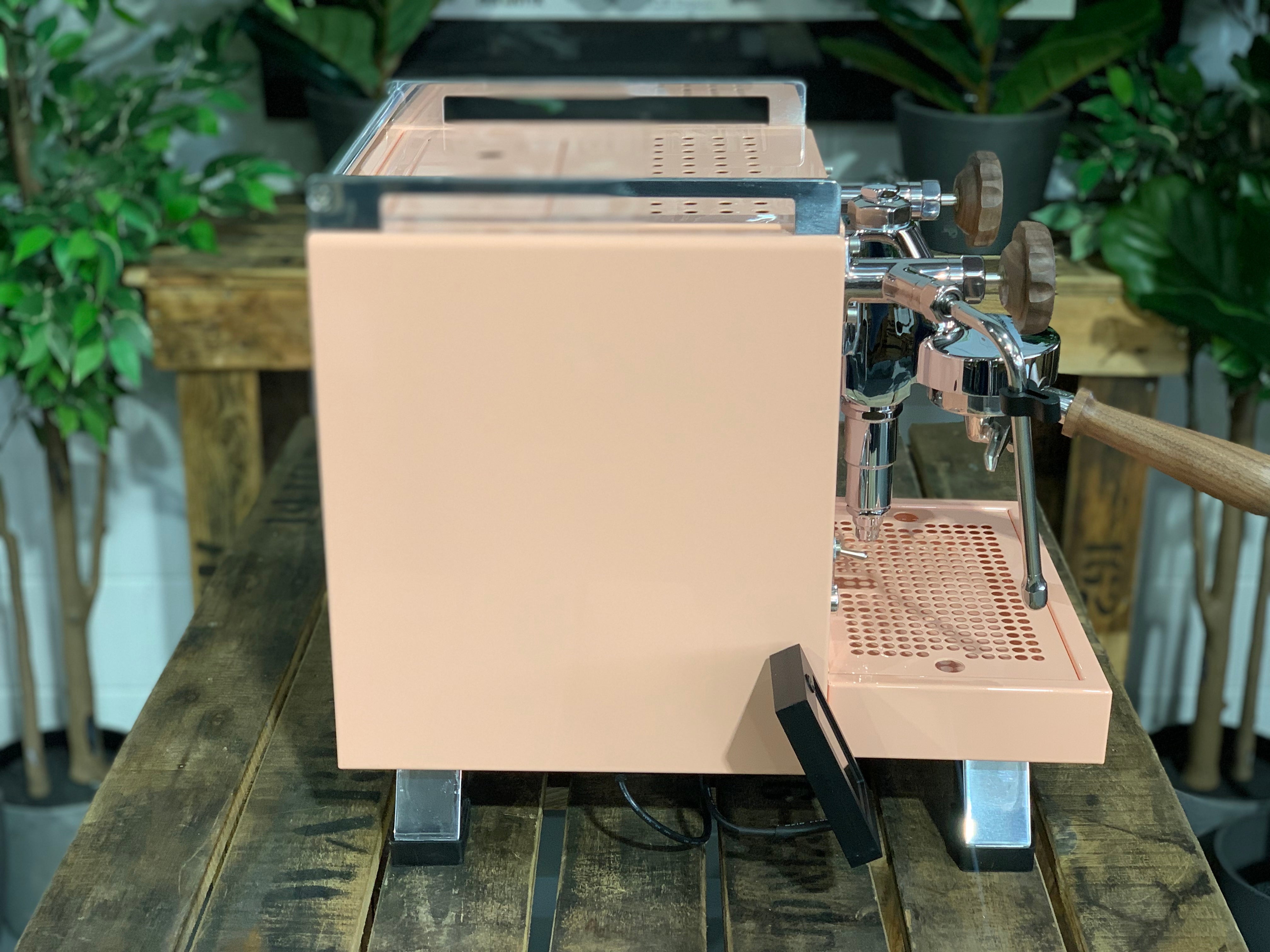Rocket Cinquantotto R58 1 Group Coffee Machine - New in pink finish on a wooden table.