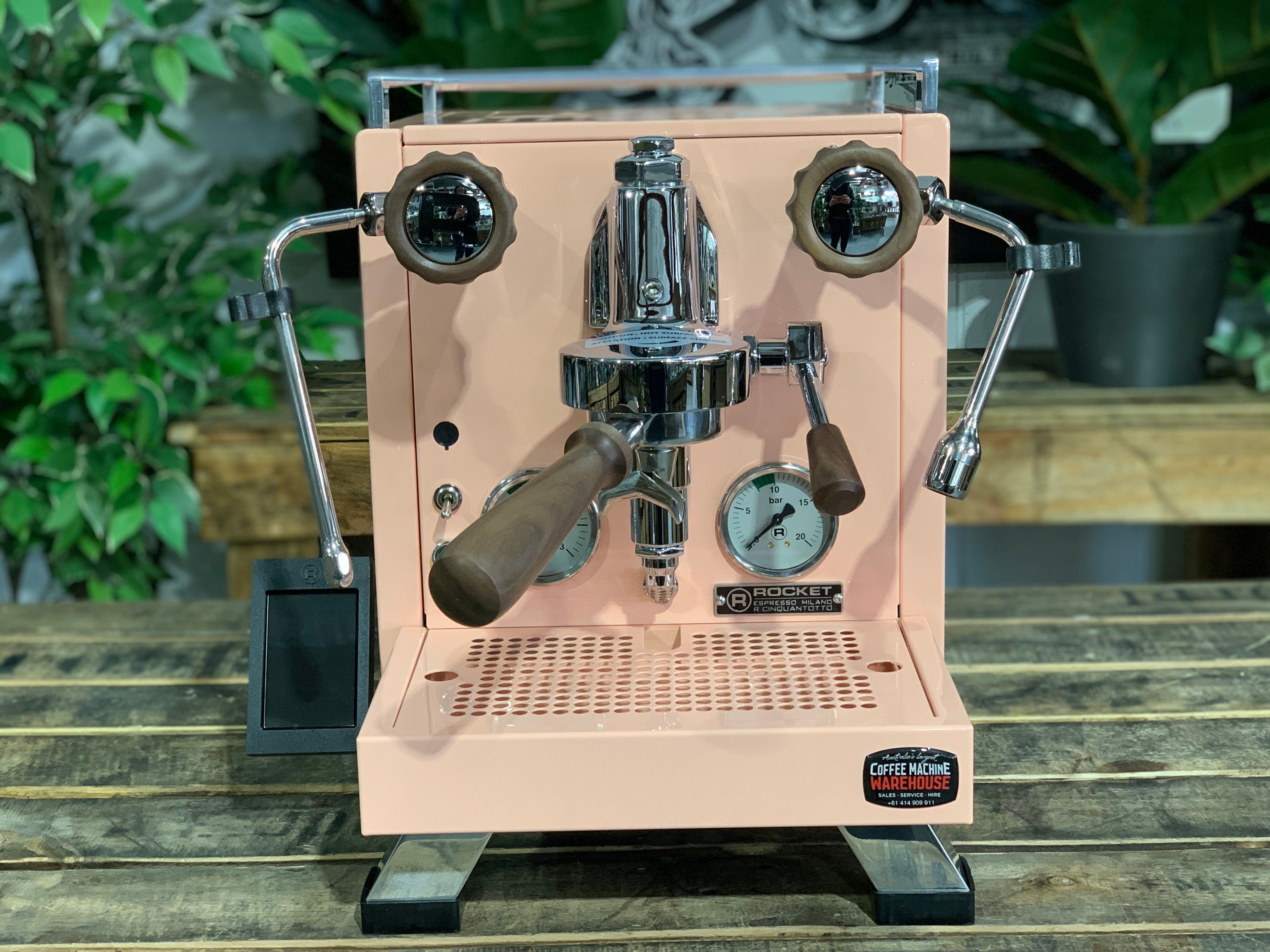 Rocket Cinquantotto R58 1 Group Coffee Machine - New in pink finish displayed on a wooden table.